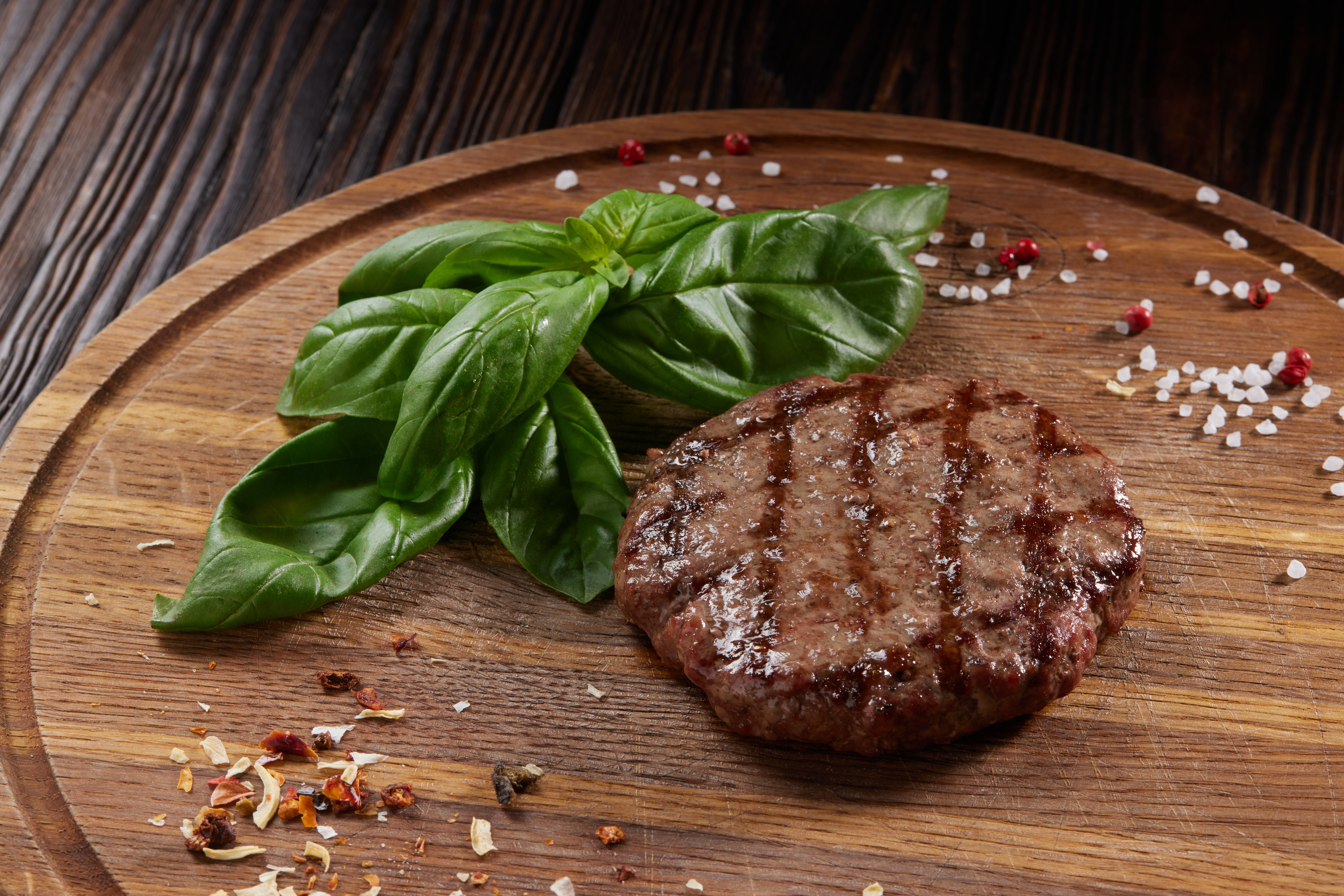 grilled steak on wooden chopping board with spinac 7c3a0a117c3381d1f9f9