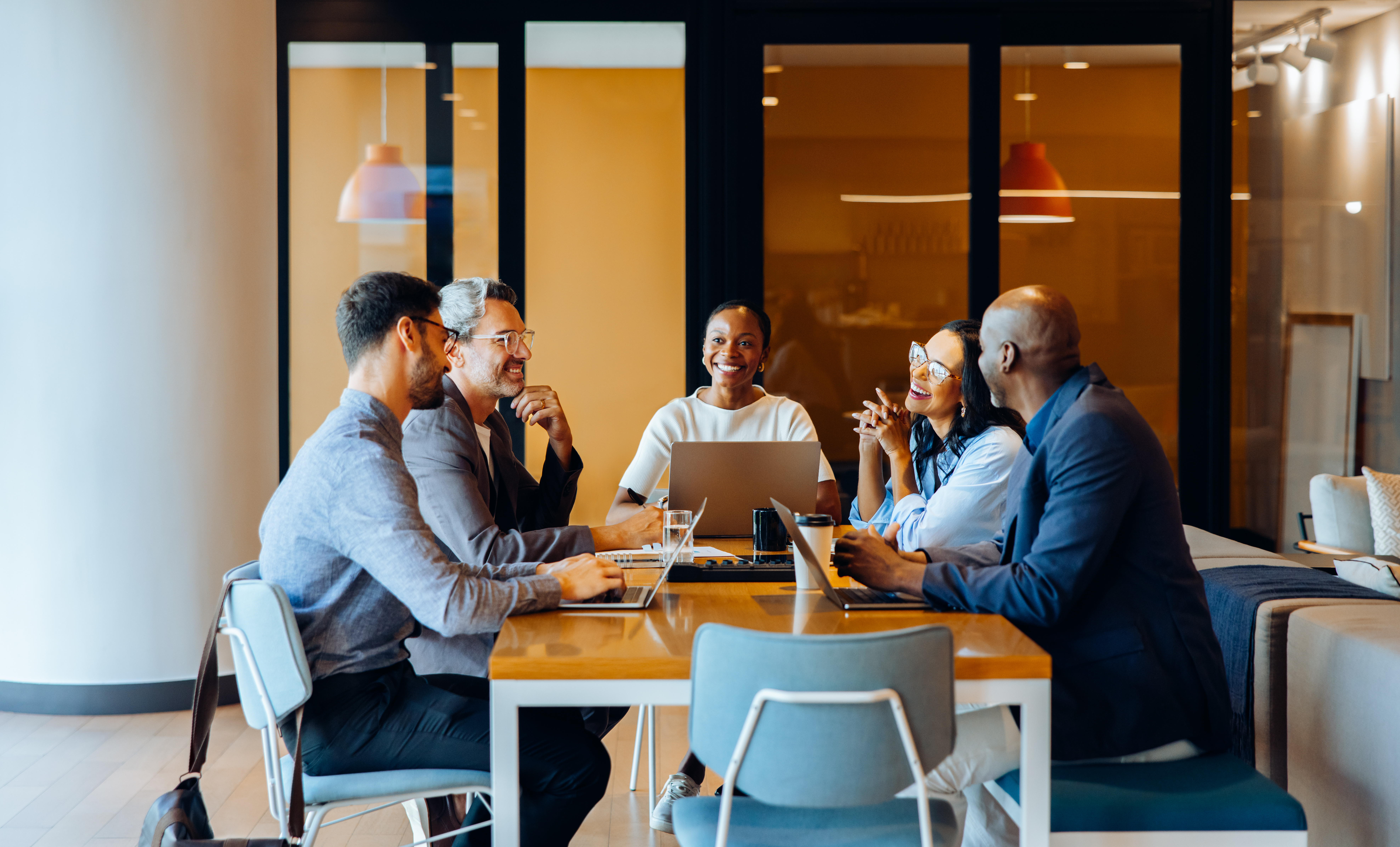 group discussing strategies in an office with lapt d5d131b759ab327857e6