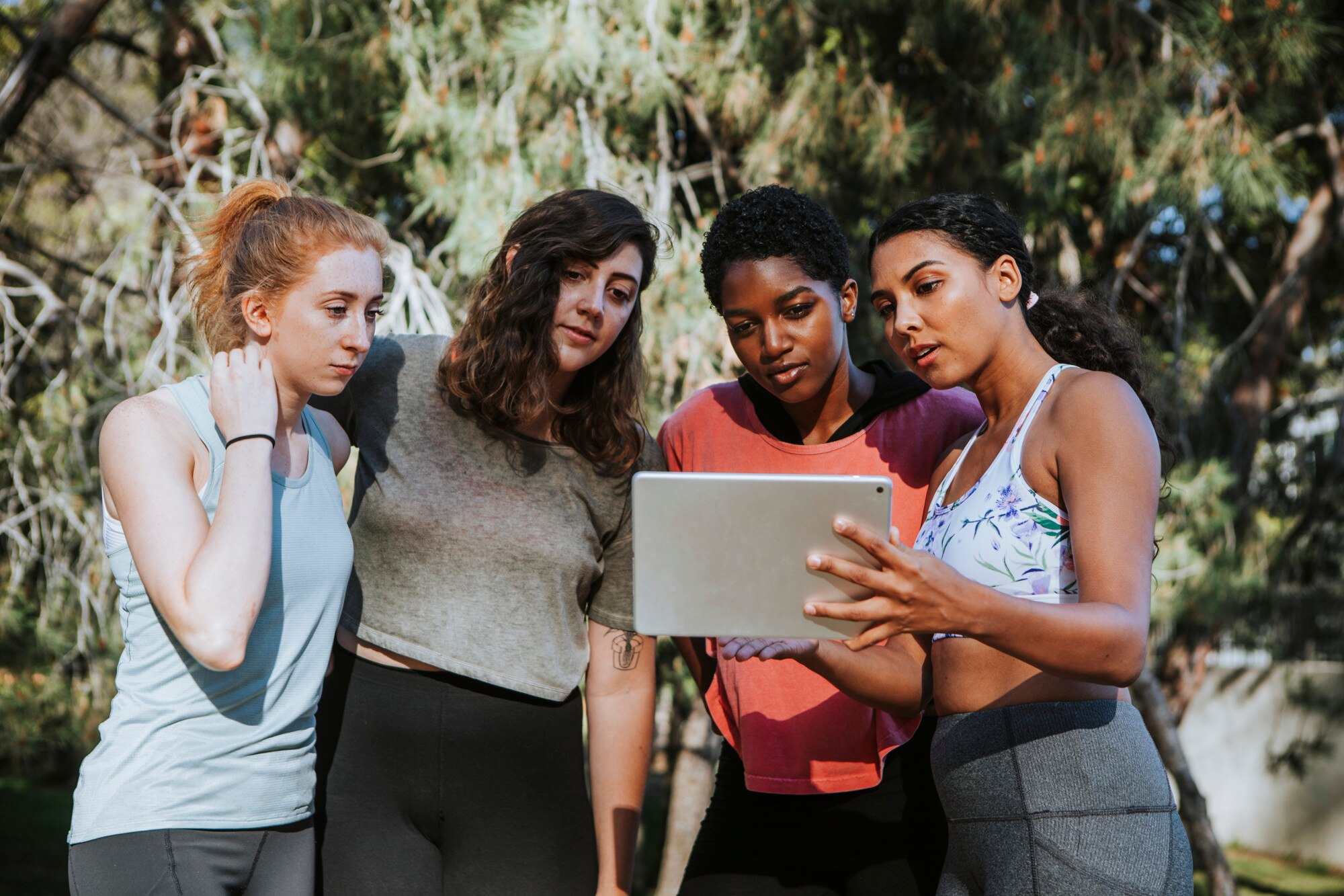 group of active women looking at a digital tablet 23fb7b2c05487f5c77cd