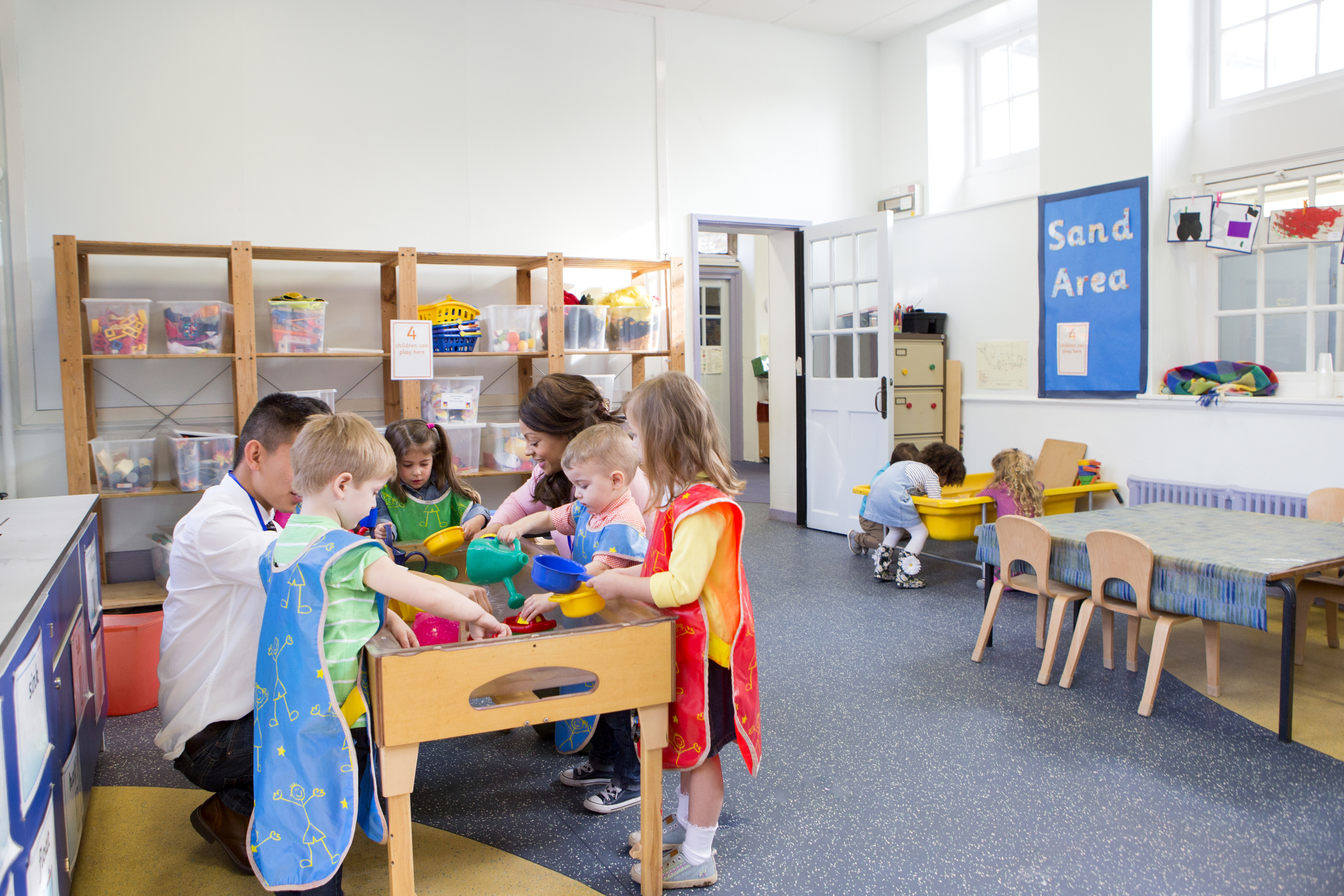 group of children playing in a classroom 771195421157ef454fc5