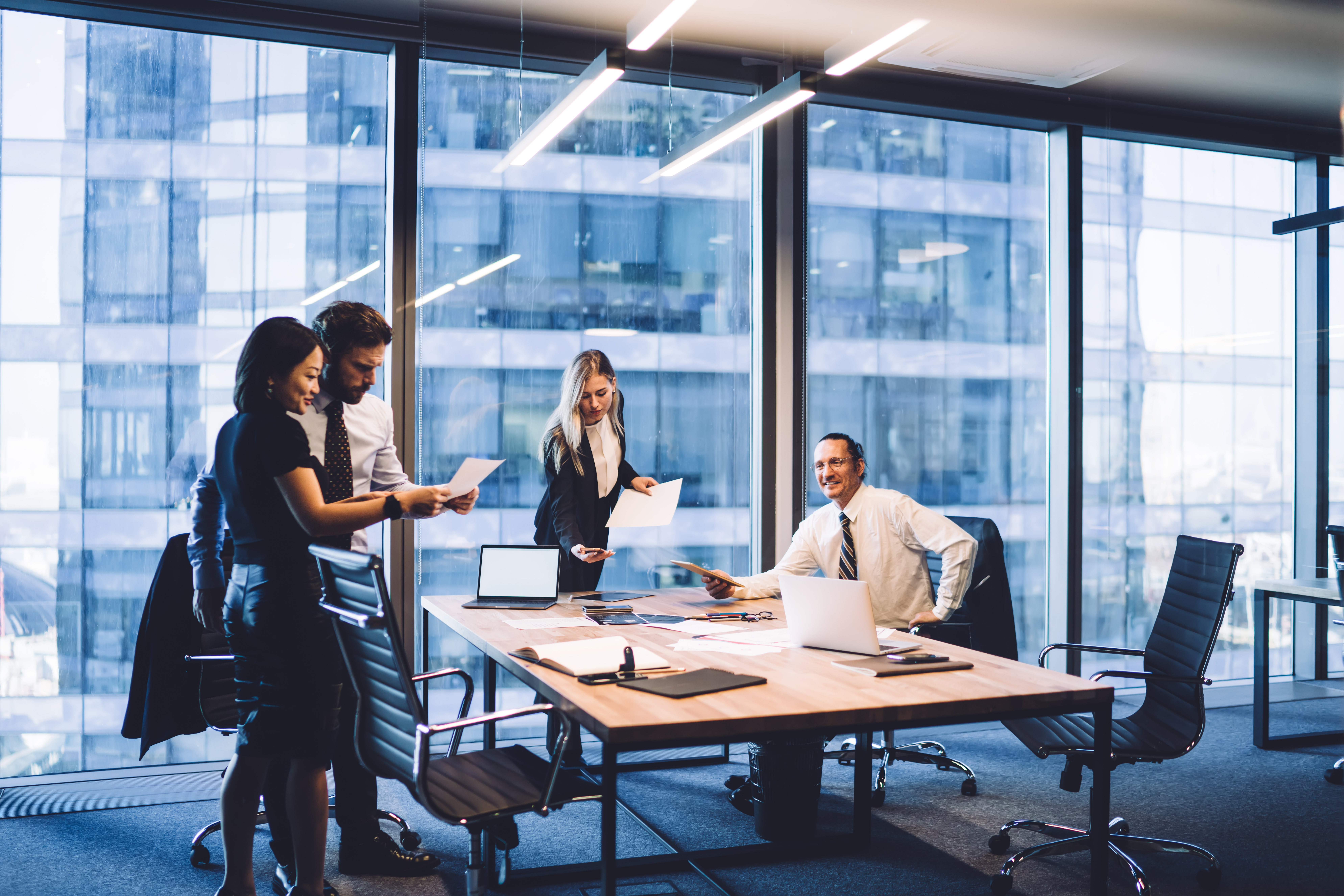 group of diverse executive managers doing paperwor dfbd022a8ac8f7a0e7b7