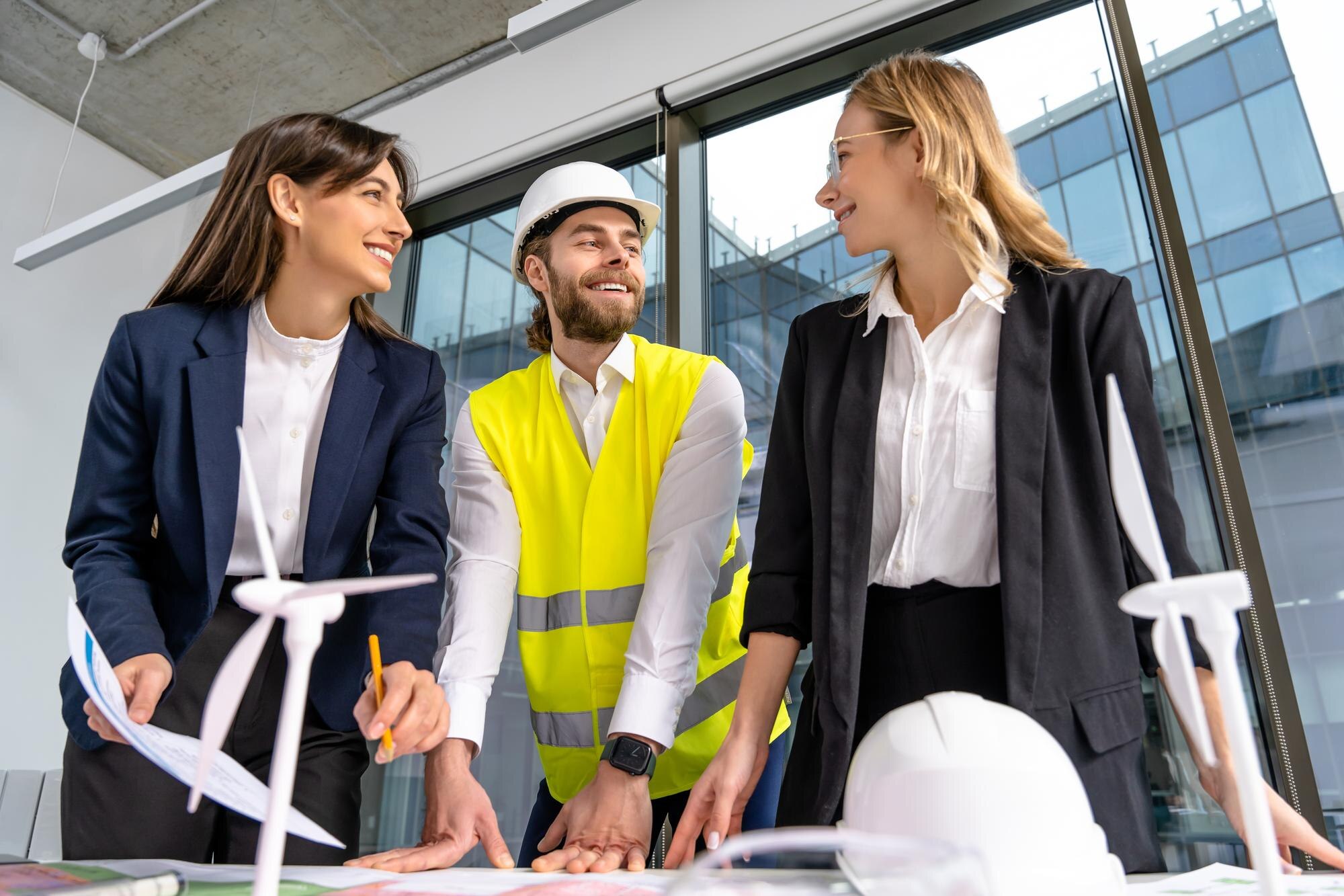 group of engineers discussing new wind power proje 1253b37d8608f0ca2f80
