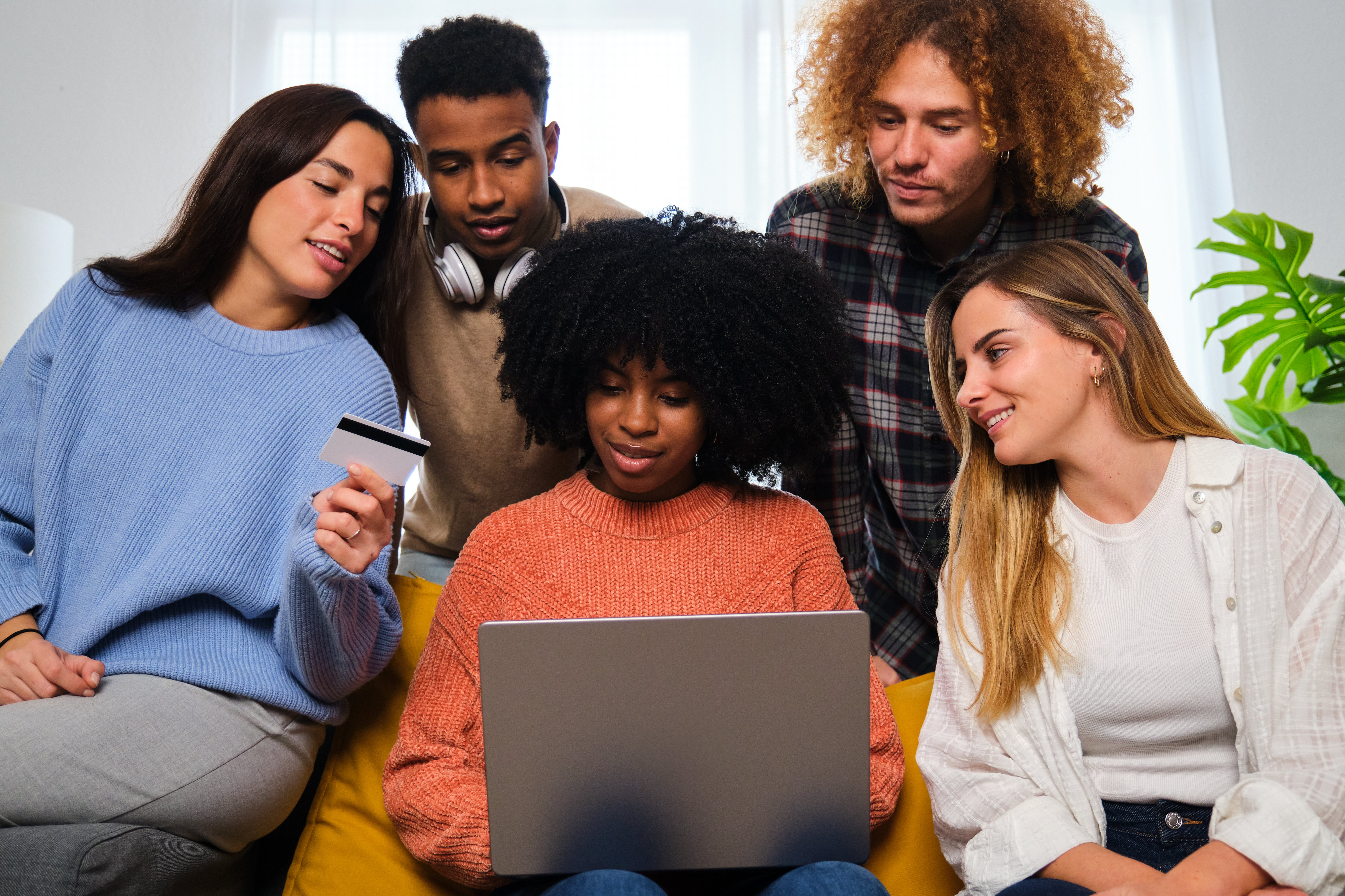 Group Of Friends Buying Online With A Laptop And A C6f9824b9e58a31b21c7