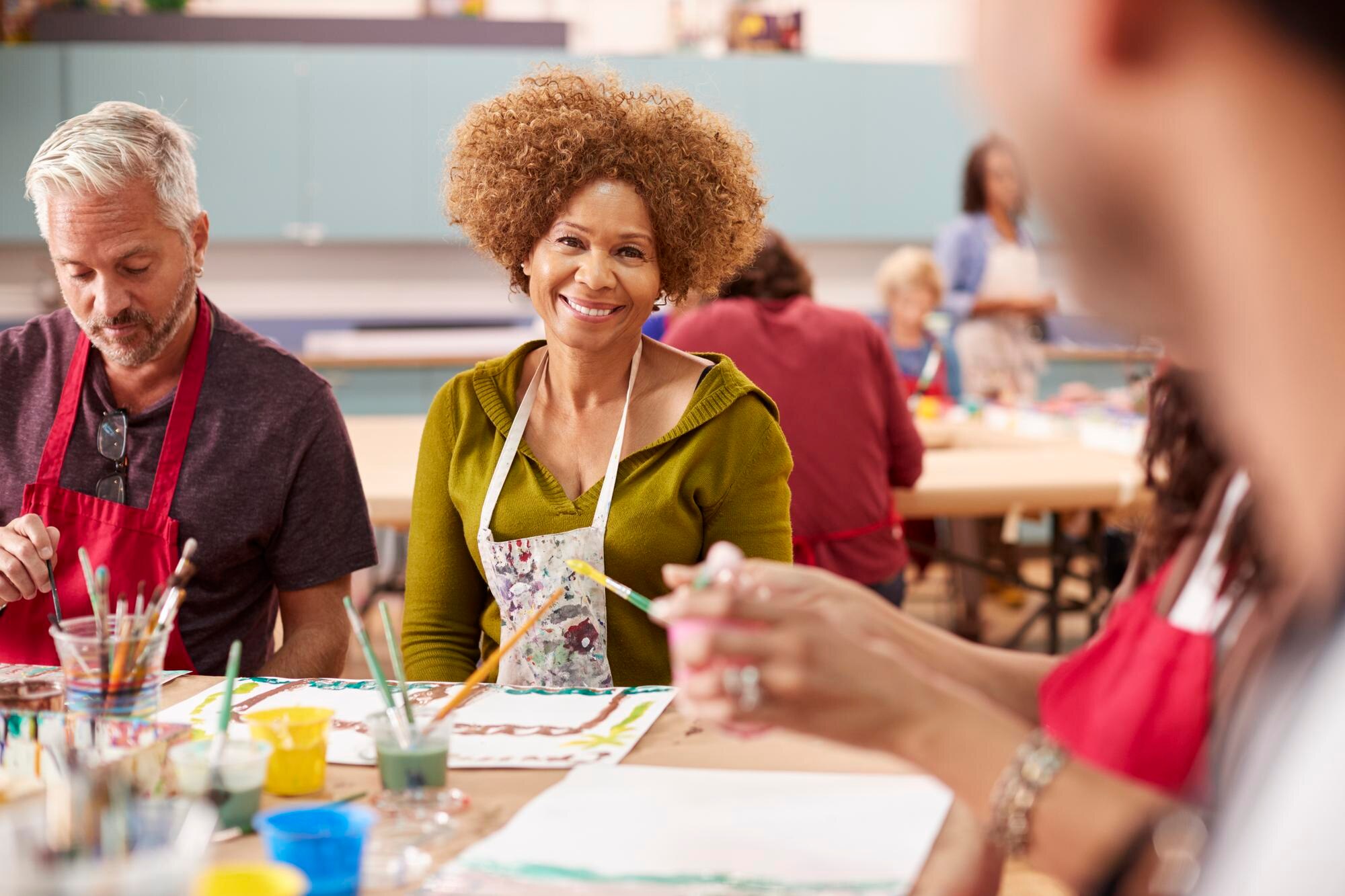Unleashing the Power of Edutainment in Community Workshops 3 group of mature adults attending art class in comm 48cb3b5475f541ff244b