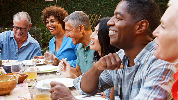 One Stop. Many Cravings. How Our Family-Owned Spot Solves the 'Everyone Wants Something Different' Dilemma! 2 group of mature friends sitting around table enjoy 76aaf947e69b77024352