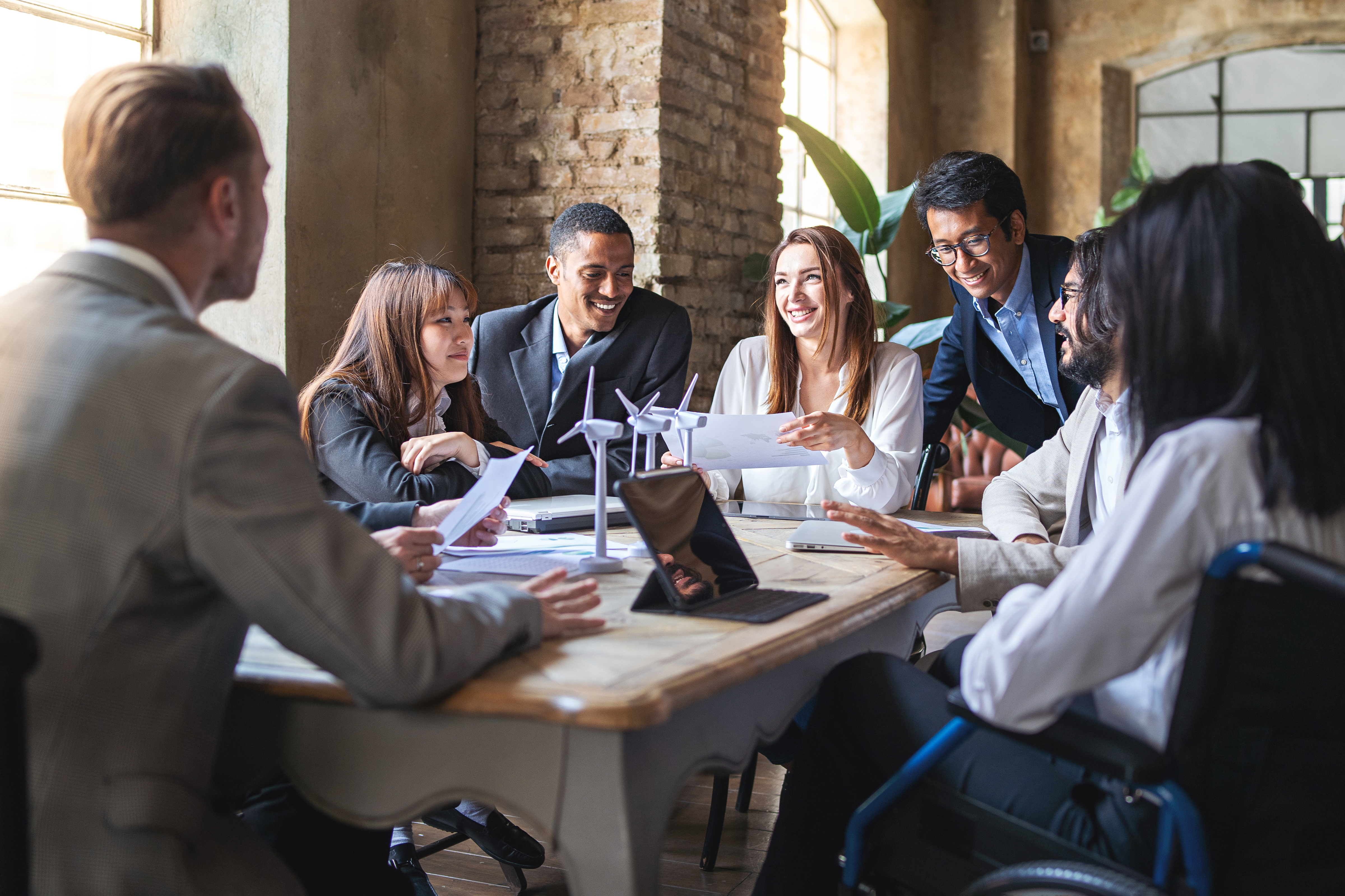group of multiethnic businesspeople discussing abo b990492e30baffe9f903
