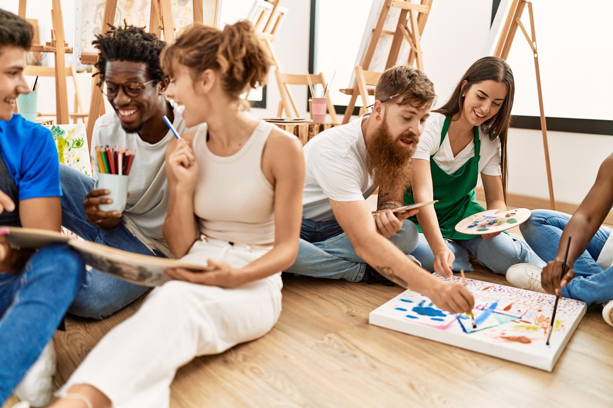 group of people smiling happy drawing sitting on t ca7f173fa013774a7c04