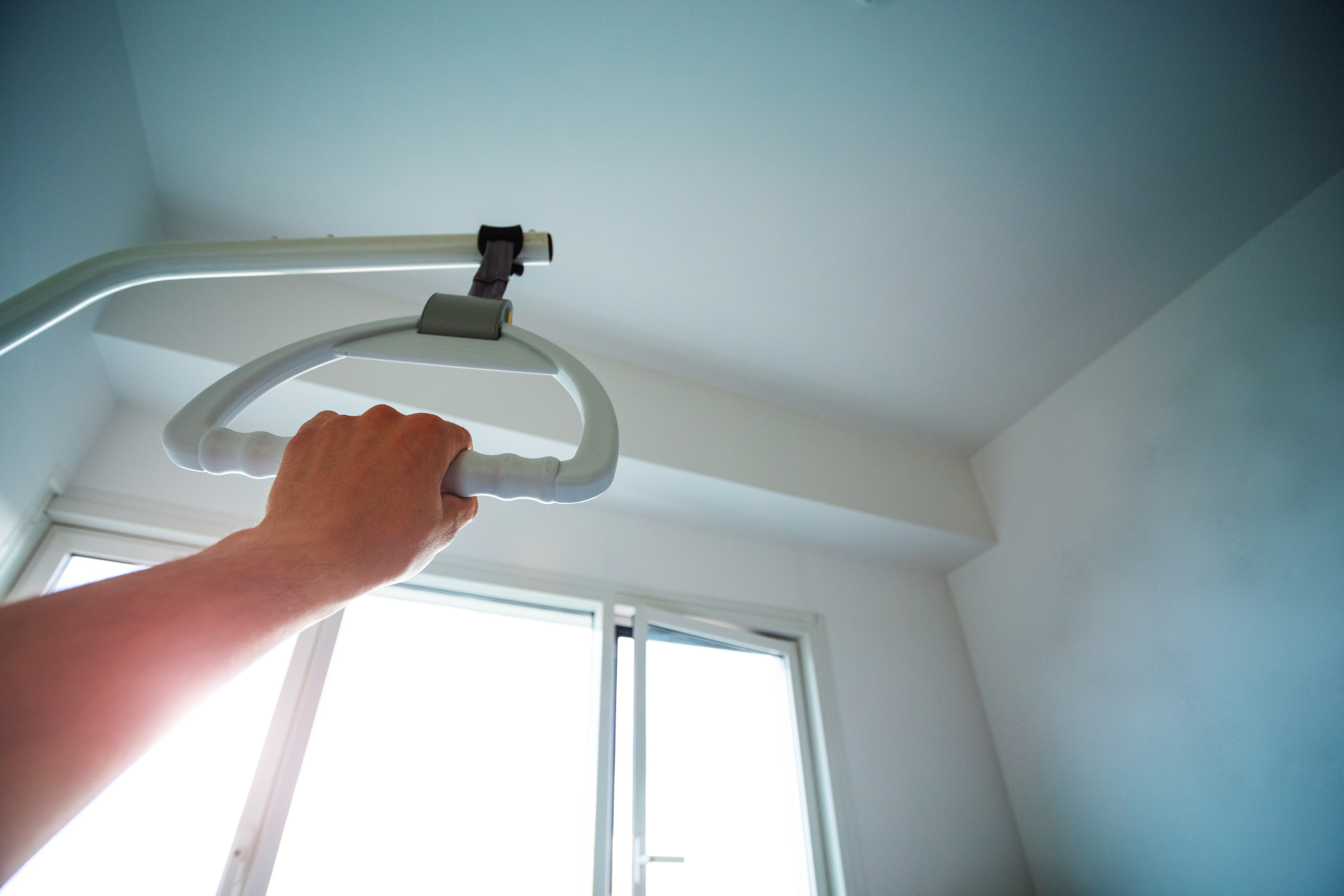 hand hold handle hanging over bed in hospital 9e3335952f1addfad3c3