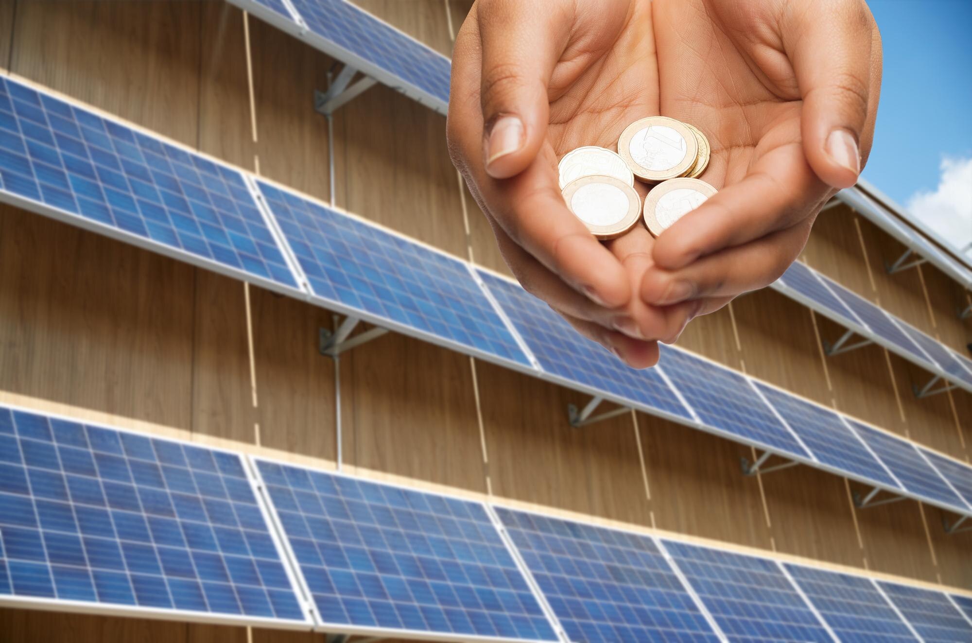 Unlocking the Financial Benefits of Solar Panels and Battery Storage 3 hands holding money over solar panels c402e4065e709cc8123d