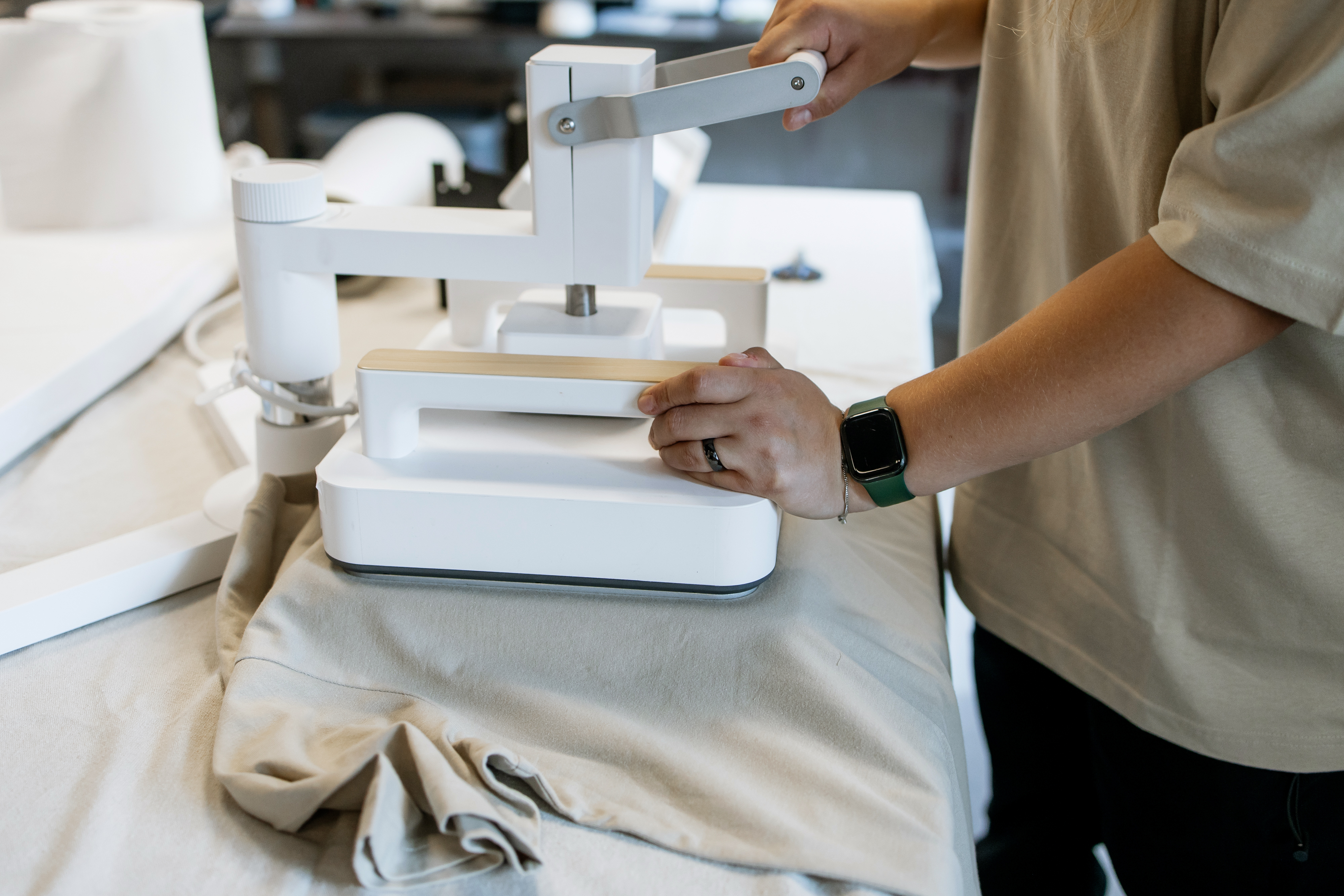 CNC Laser Cutting and Vacuum Forming: The Advantages That Power Smarter Plastic Projects 1 hands operating modern heat press machine on t shi 834a9c24c3215b85e566