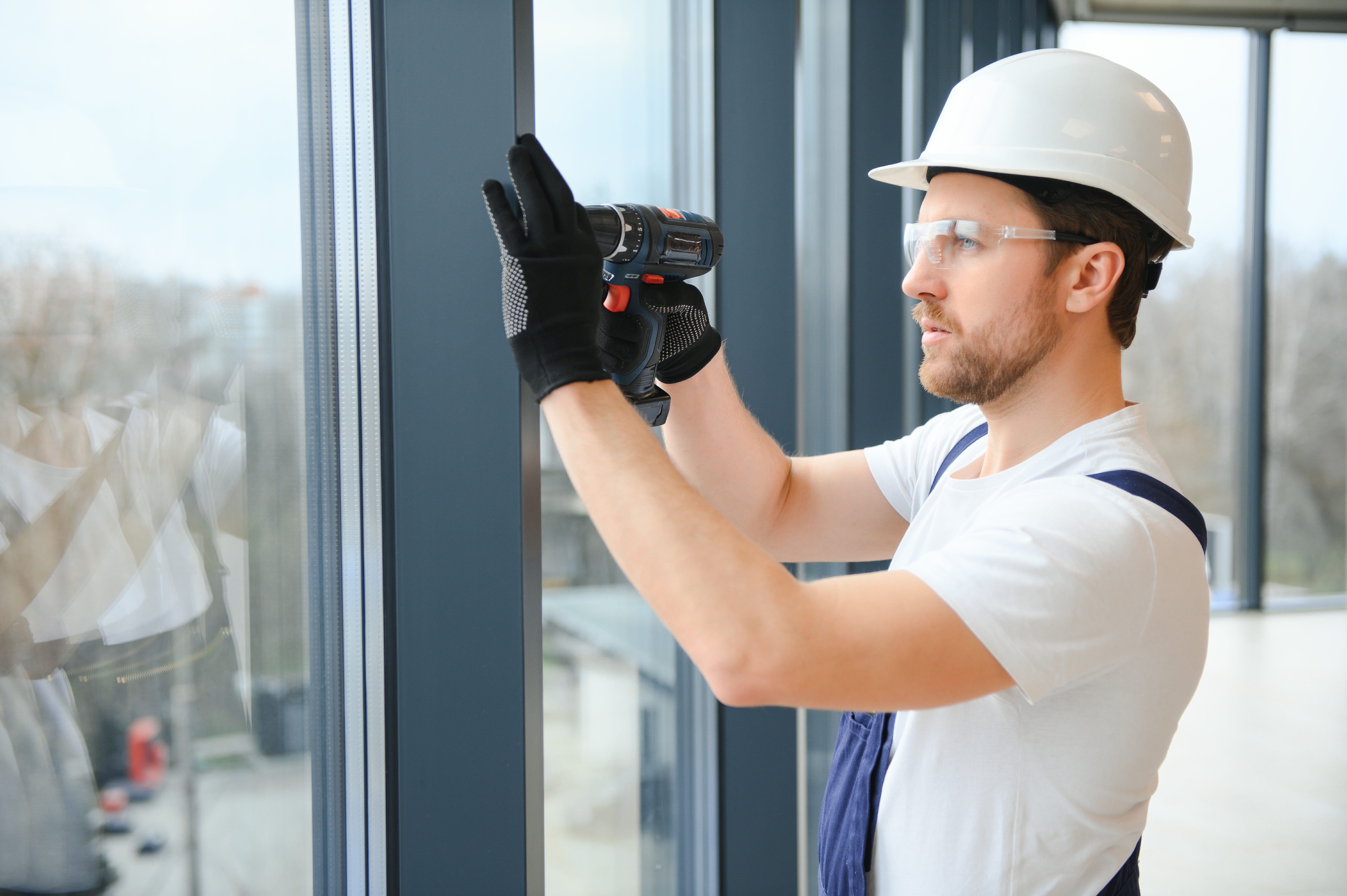Top Fabrication Challenges for Tradies and DIY Enthusiasts — and How Plastics Solve Them 2 handsome young man installing bay window in new ho 0a5fdcd2a6f857c4ce88