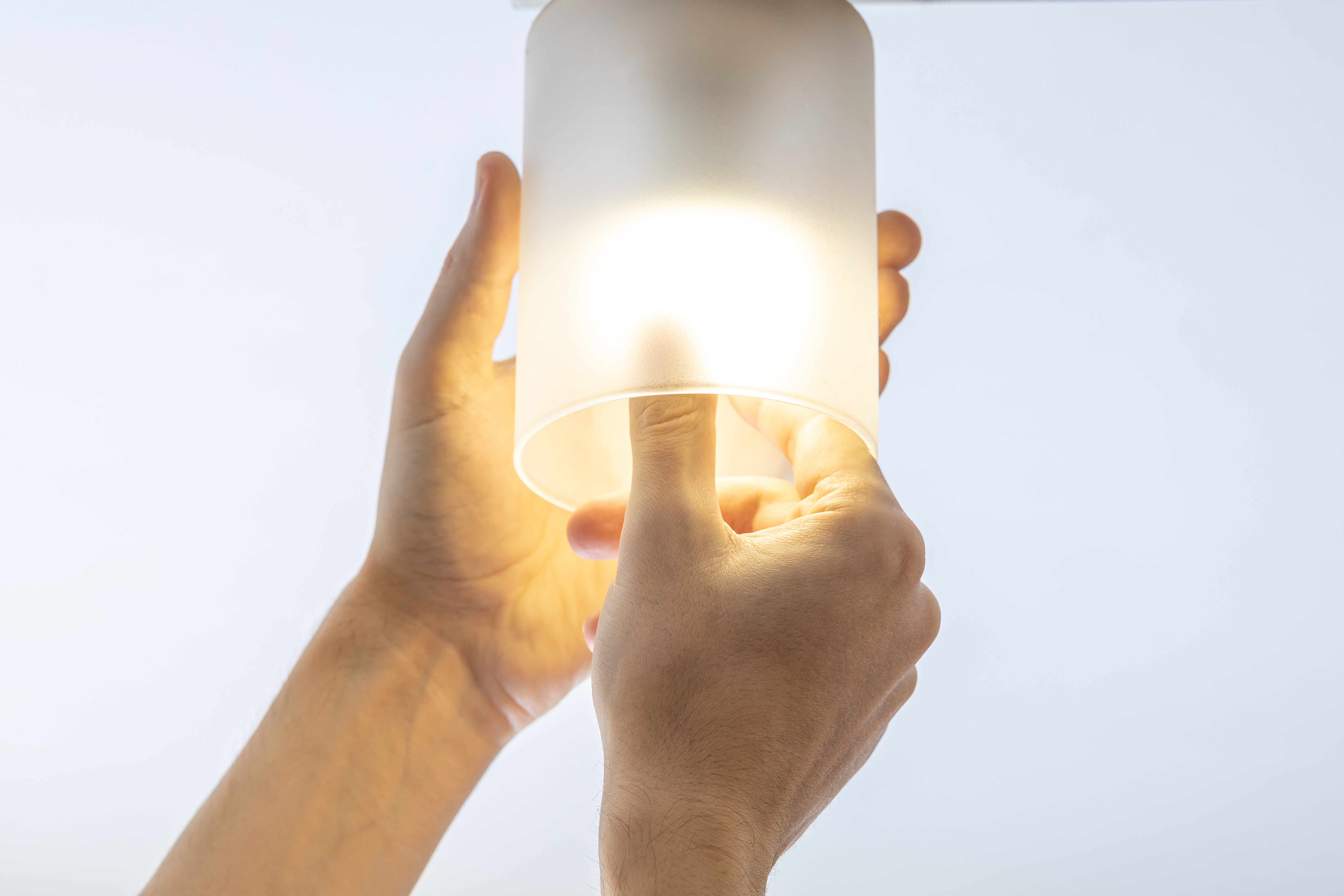 Top Applications for Custom Fabricated Plastics in Trade and Commercial Projects 3 handyman replacing light bulb at wall lamp changi 51b9793816a11a813149