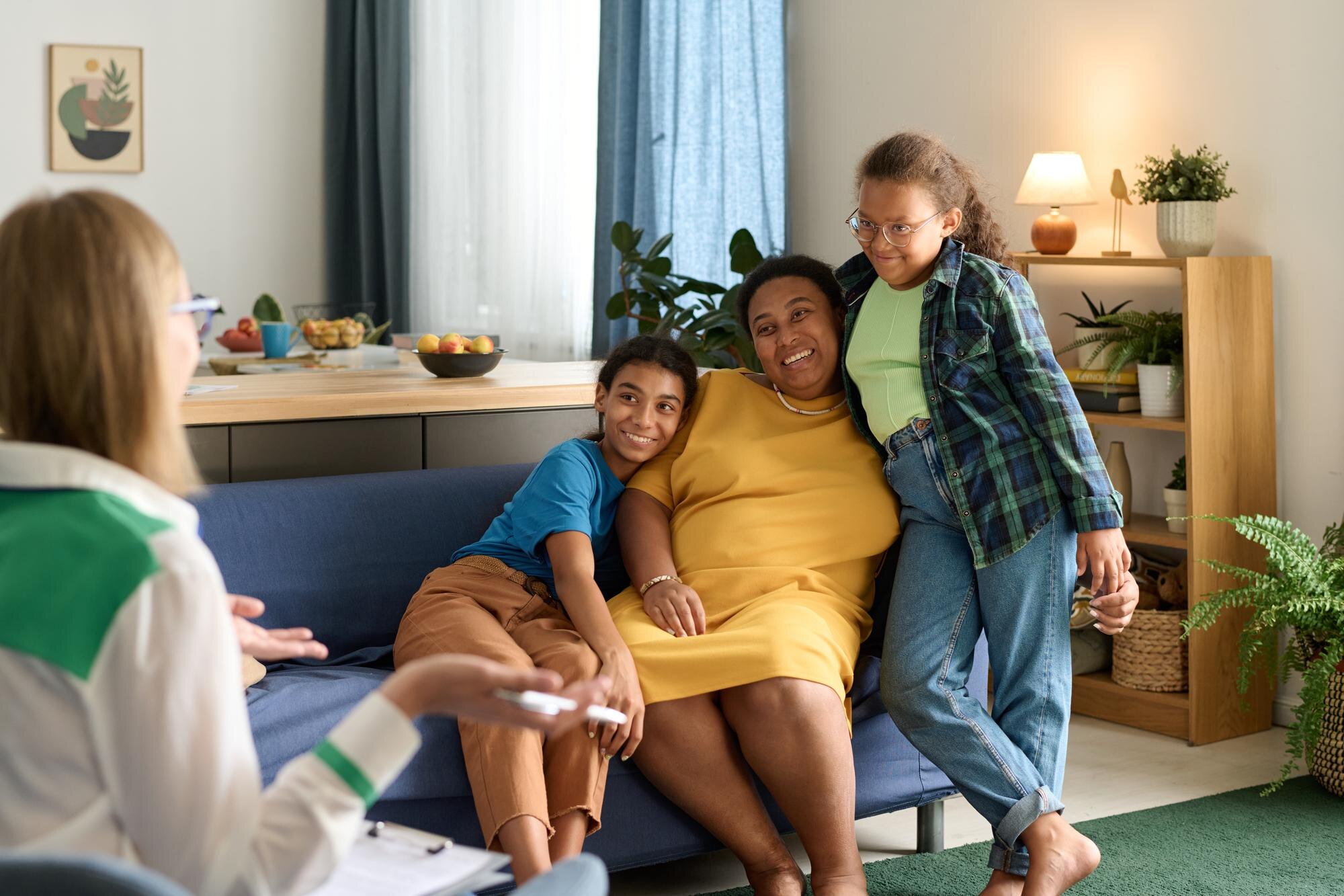 happy adoptive family talking to social worker dur 65d6aadde5ef58ed49a6