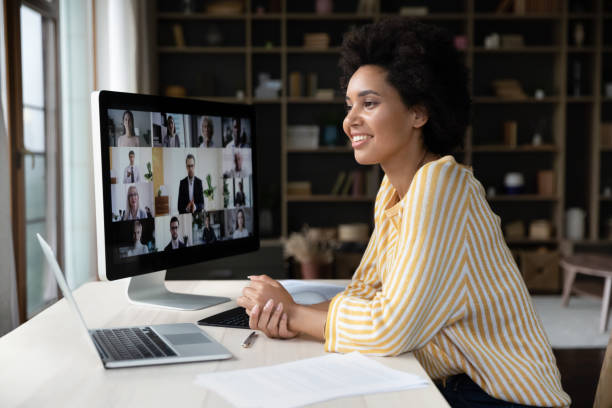 Navigating Imposter Syndrome in Remote and Hybrid Workspaces: Empowering Your Virtual Self Happy African American Employee Talking On Video C 9808da80f7393d0300ee