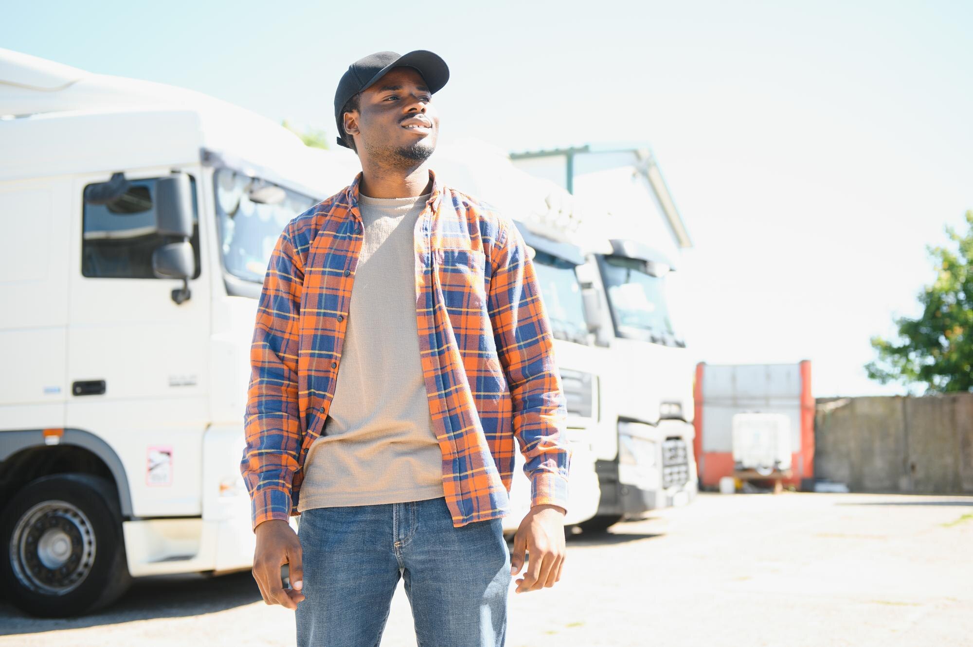 happy african american truck driver on parking cop c2cd67235ae8febe231a