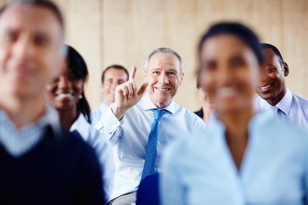 happy businessman meeting and question in seminar c0ad91828467a89cf2f6