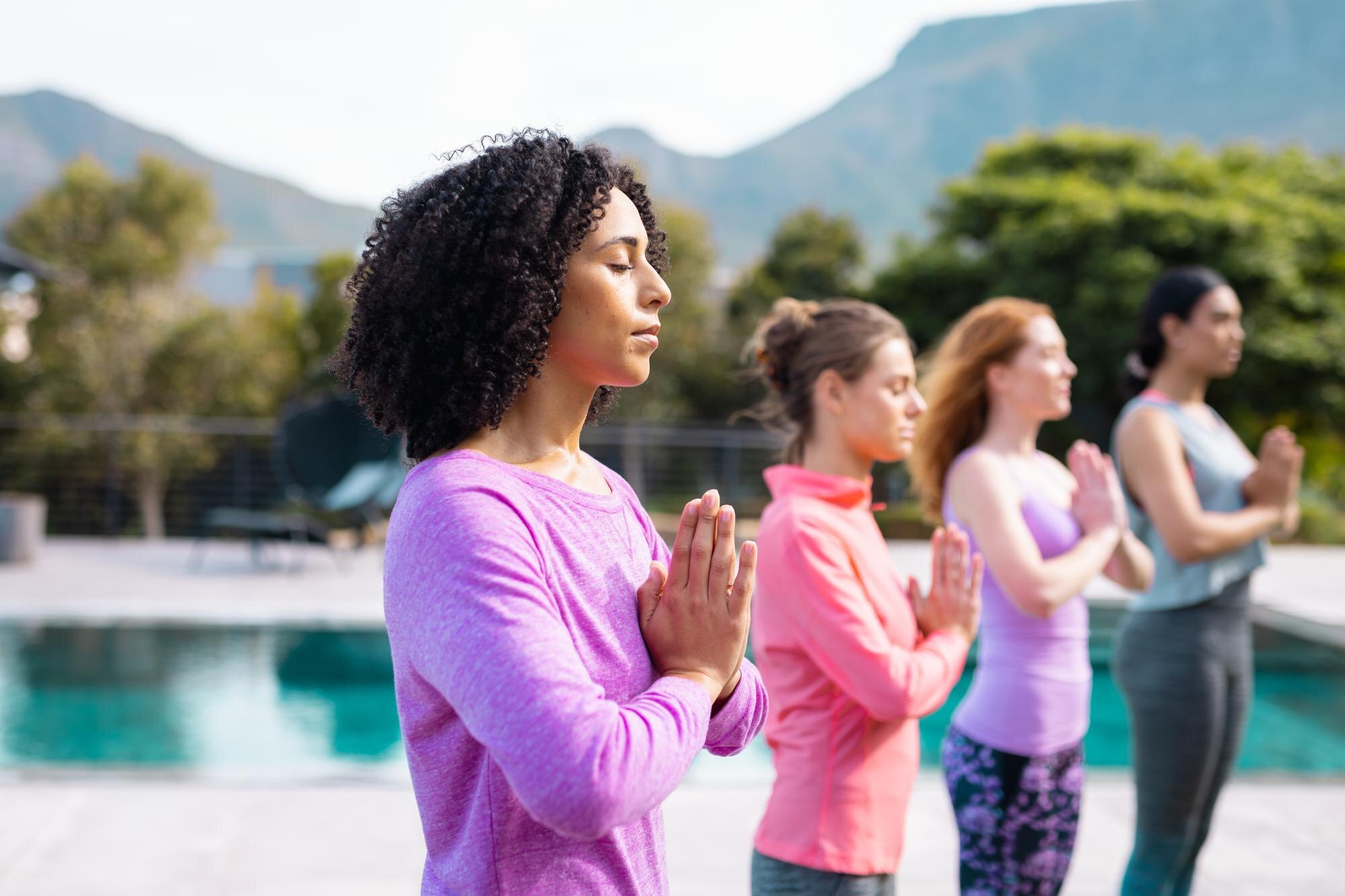 happy diverse friends practicing yoga and meditati ea6c94d377a8b3f99d9e