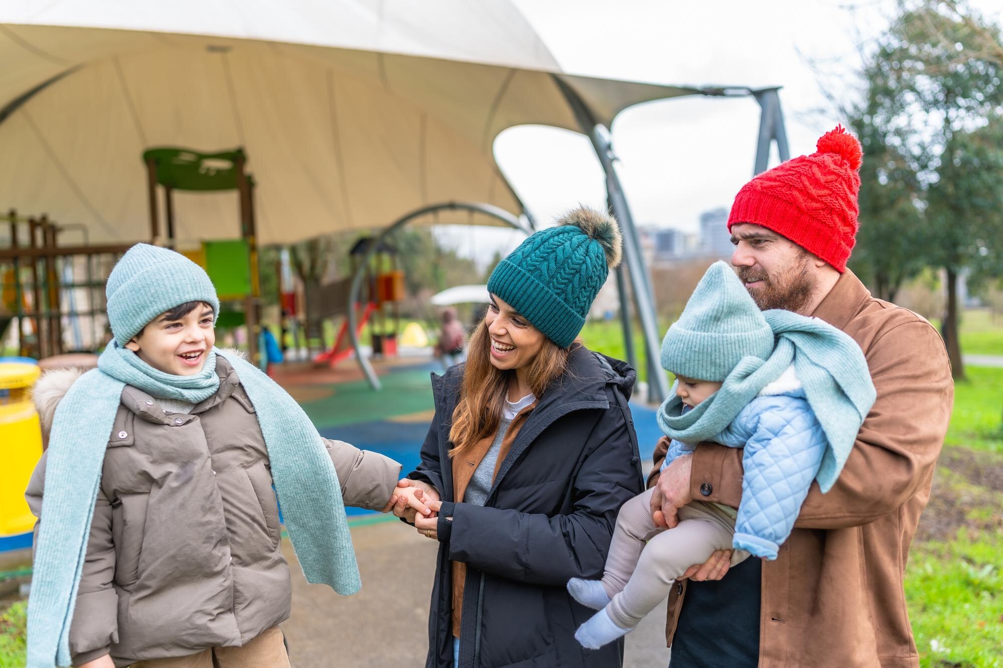 happy family enjoying time together at playground e4f89da56dd73283f7b4