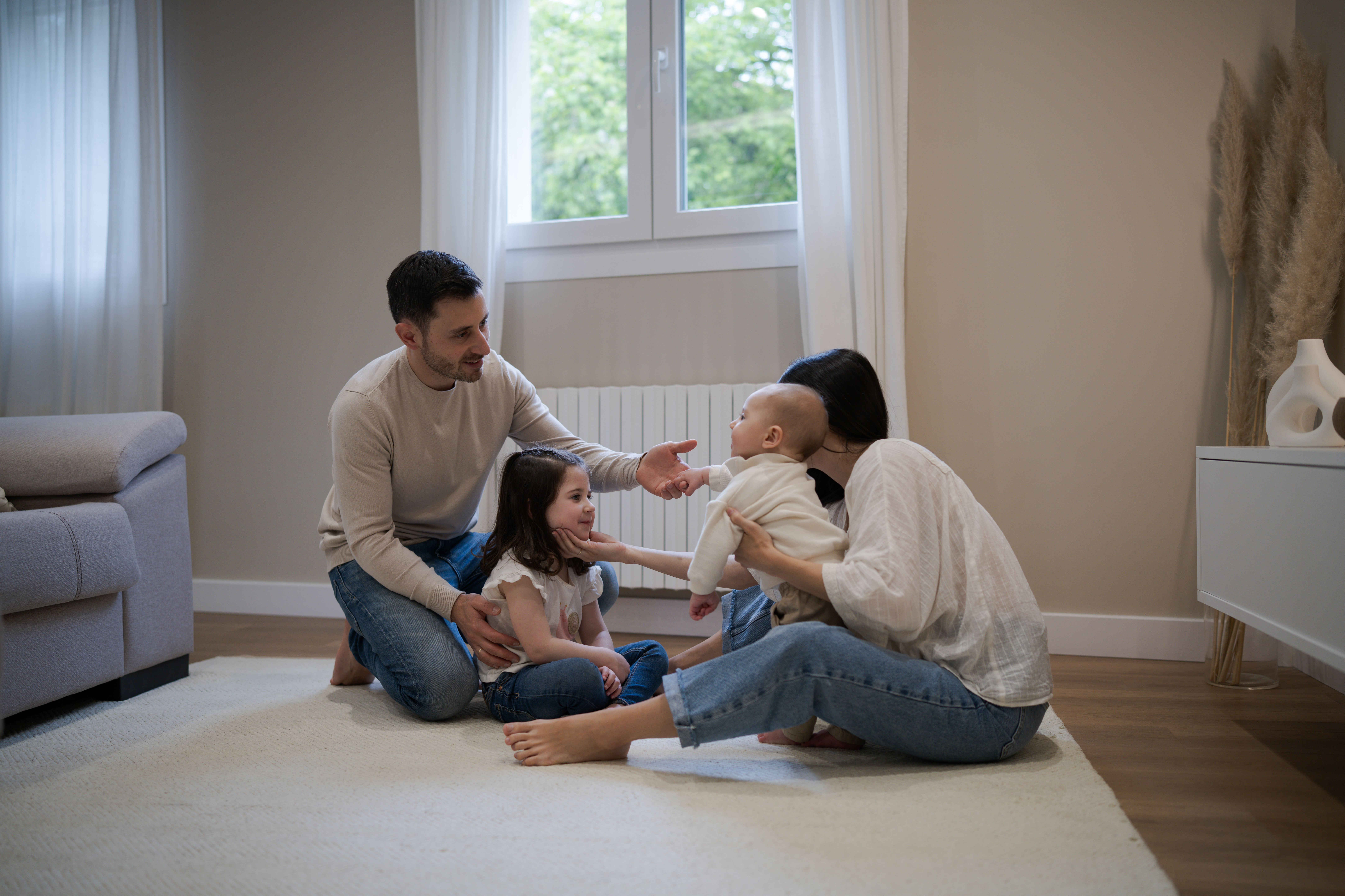 happy family playing together on the floor at home be42b4a05f50840cb4d0