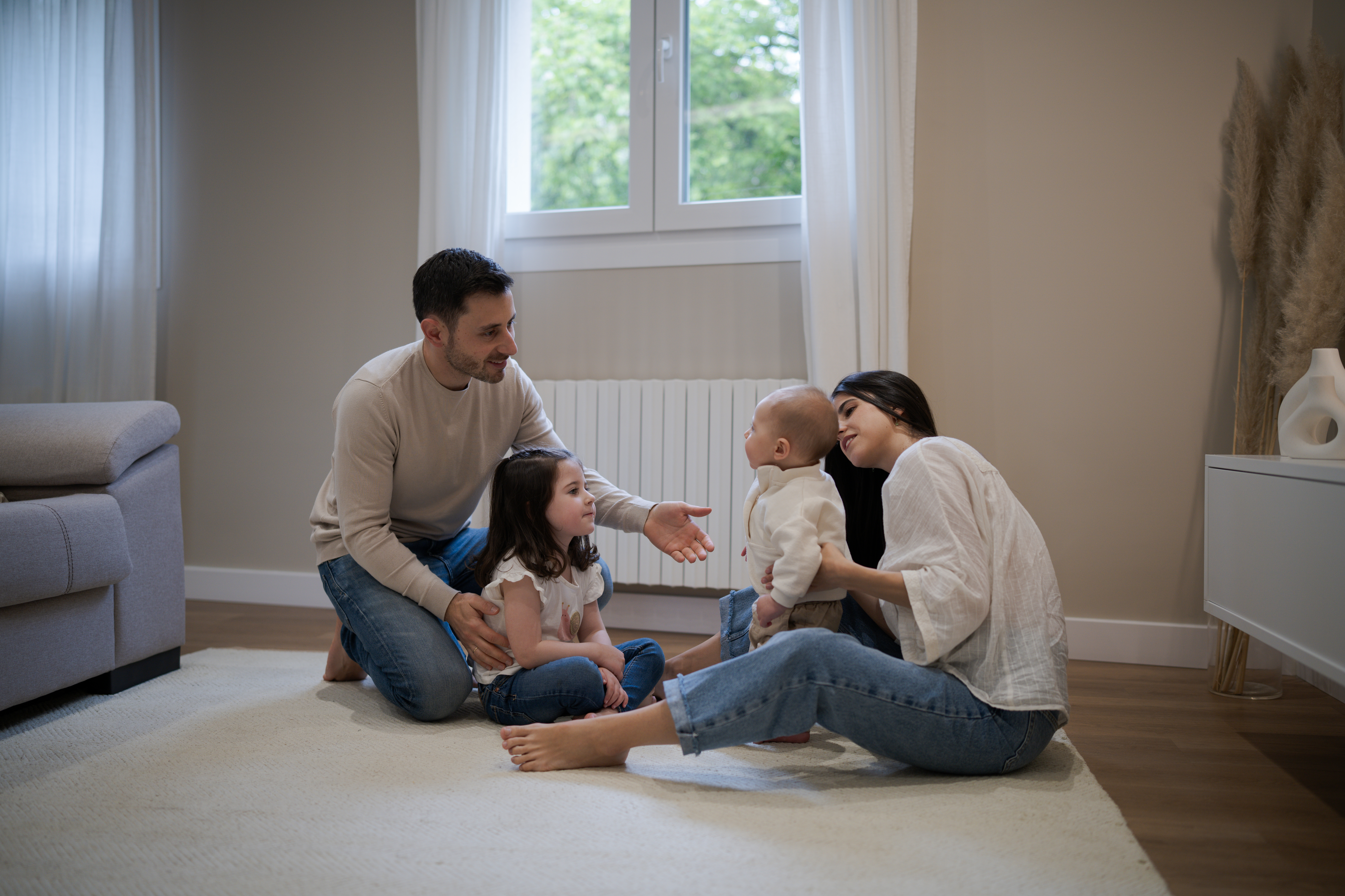 happy family playing together on the floor at home c5a529071c8c79409374