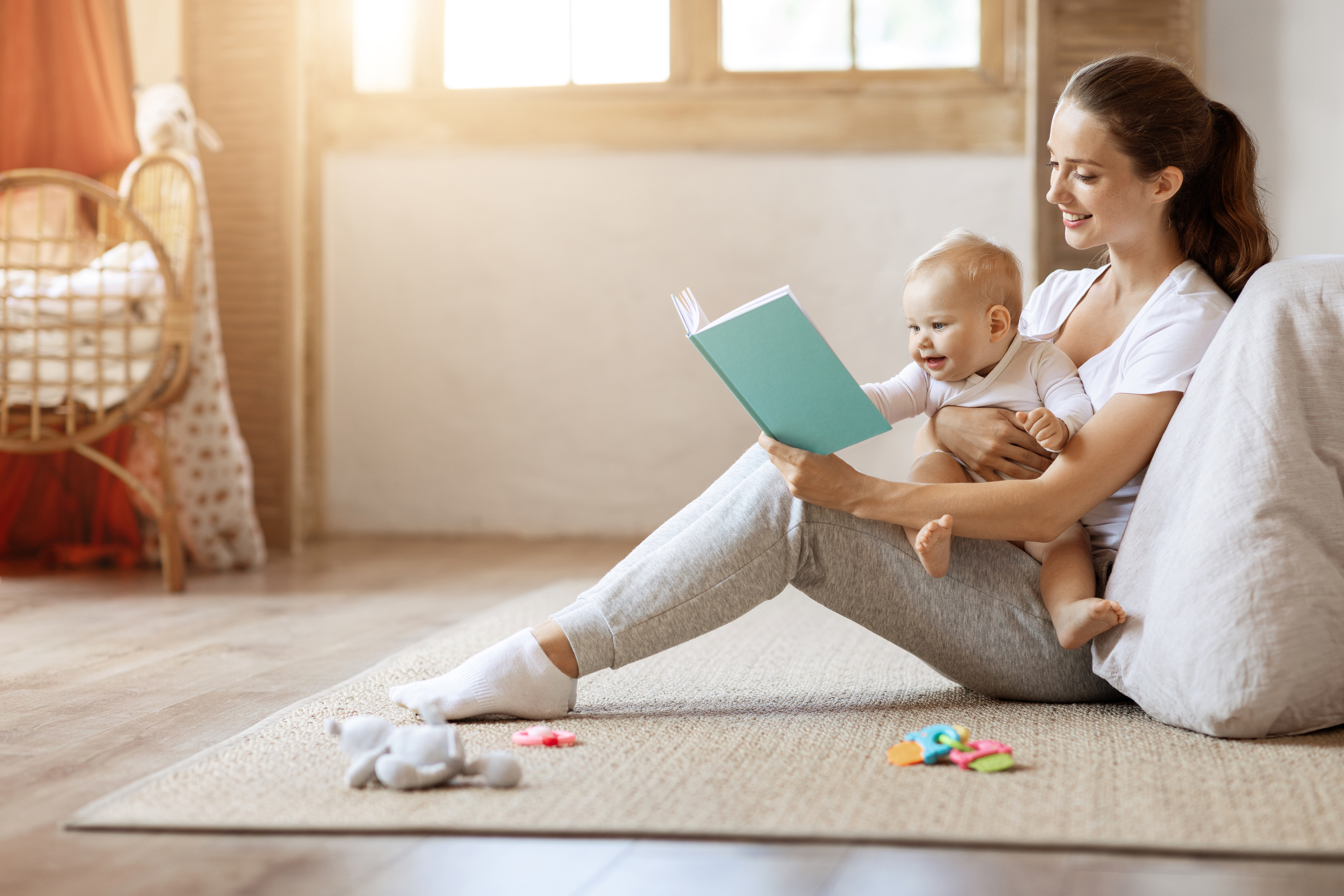best books for new parents - mother reading to baby