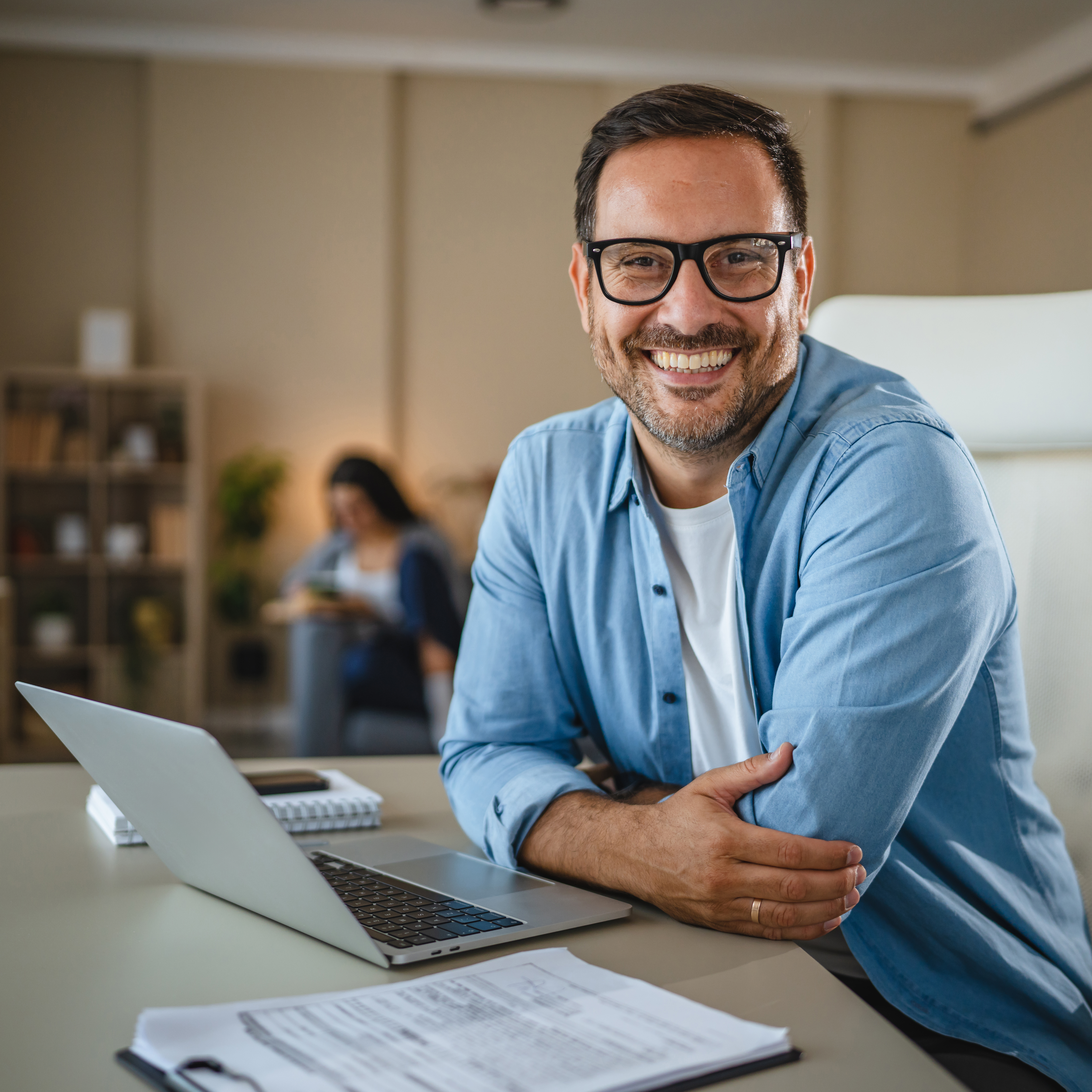 happy man working from home smiling at camera ea8b8099c24f7b6237a0