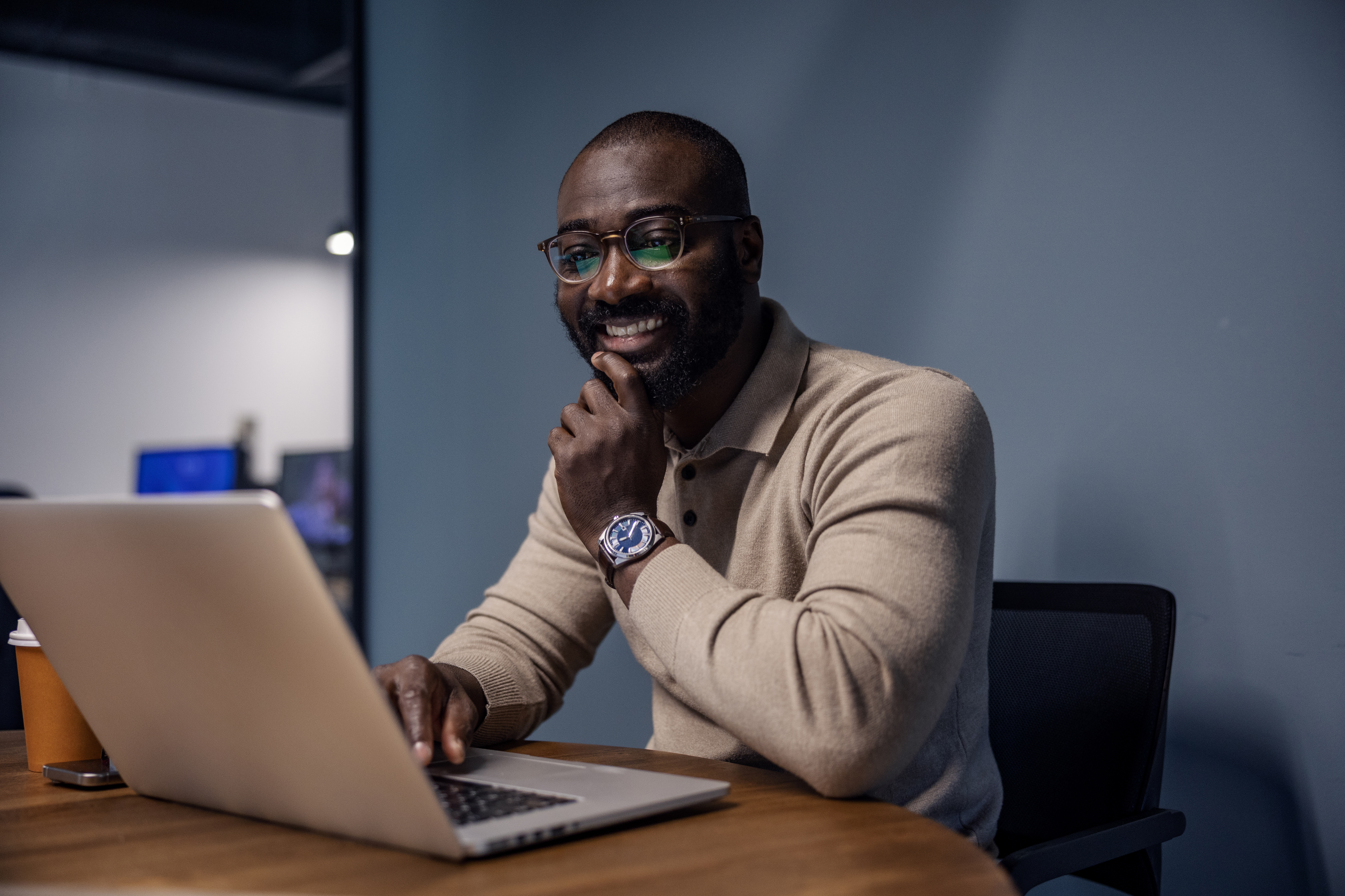 happy man working on laptop in modern office 9a44781682294af9f360