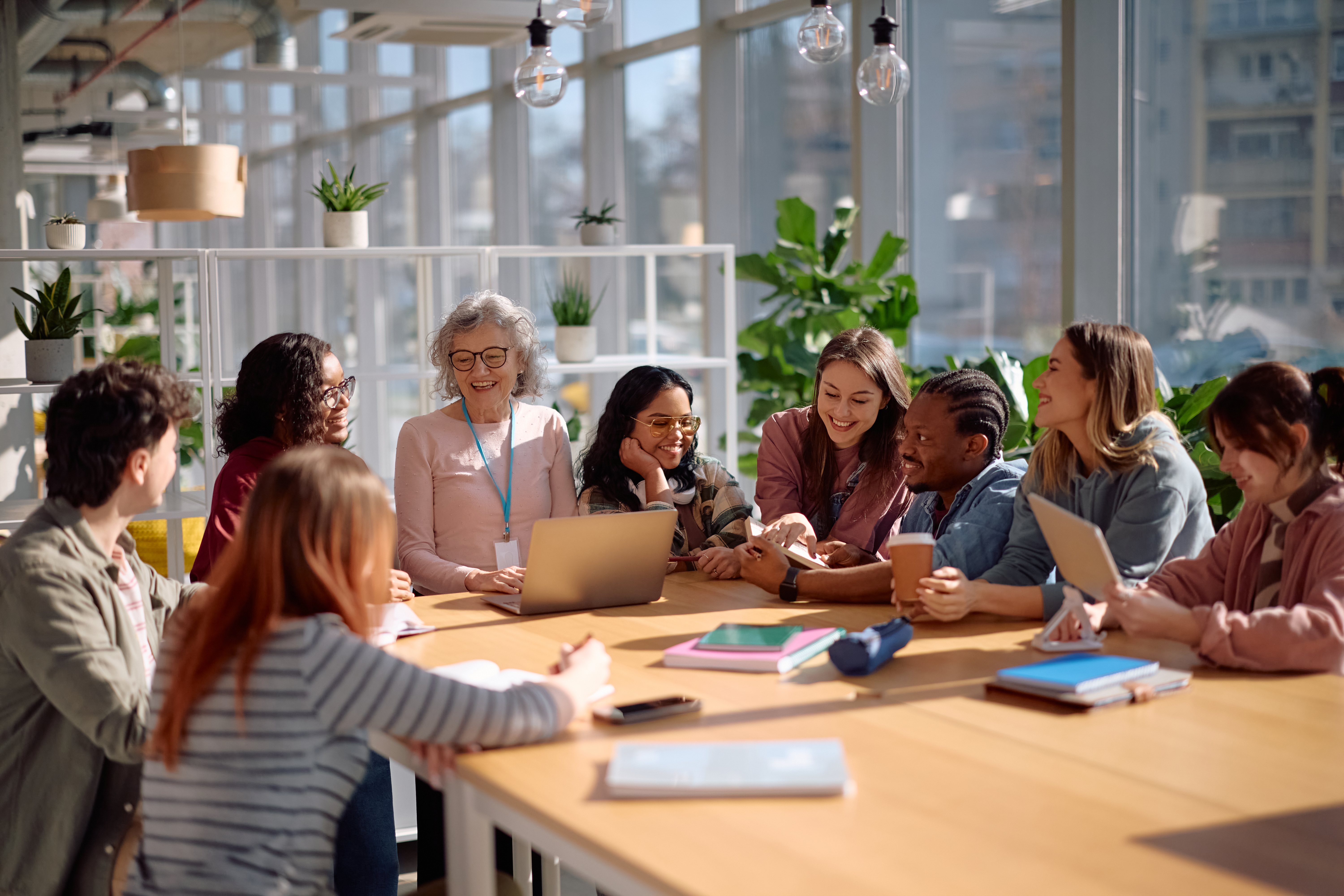 Happy Mature Teacher And Her Students During A Cla 1c7560fe23774711ce2d
