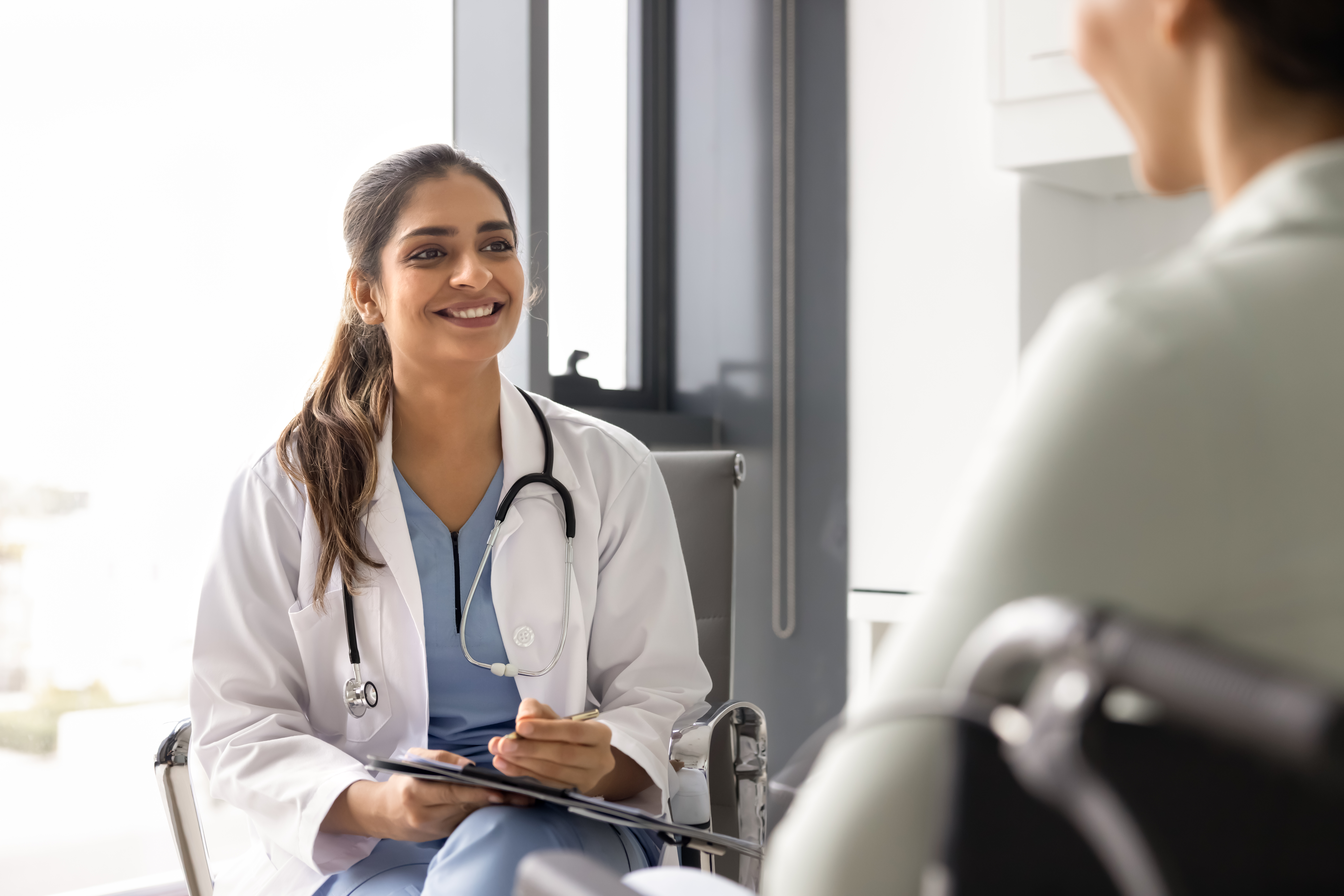 Physician talking with healthcare consultant about leaving corporate medicine