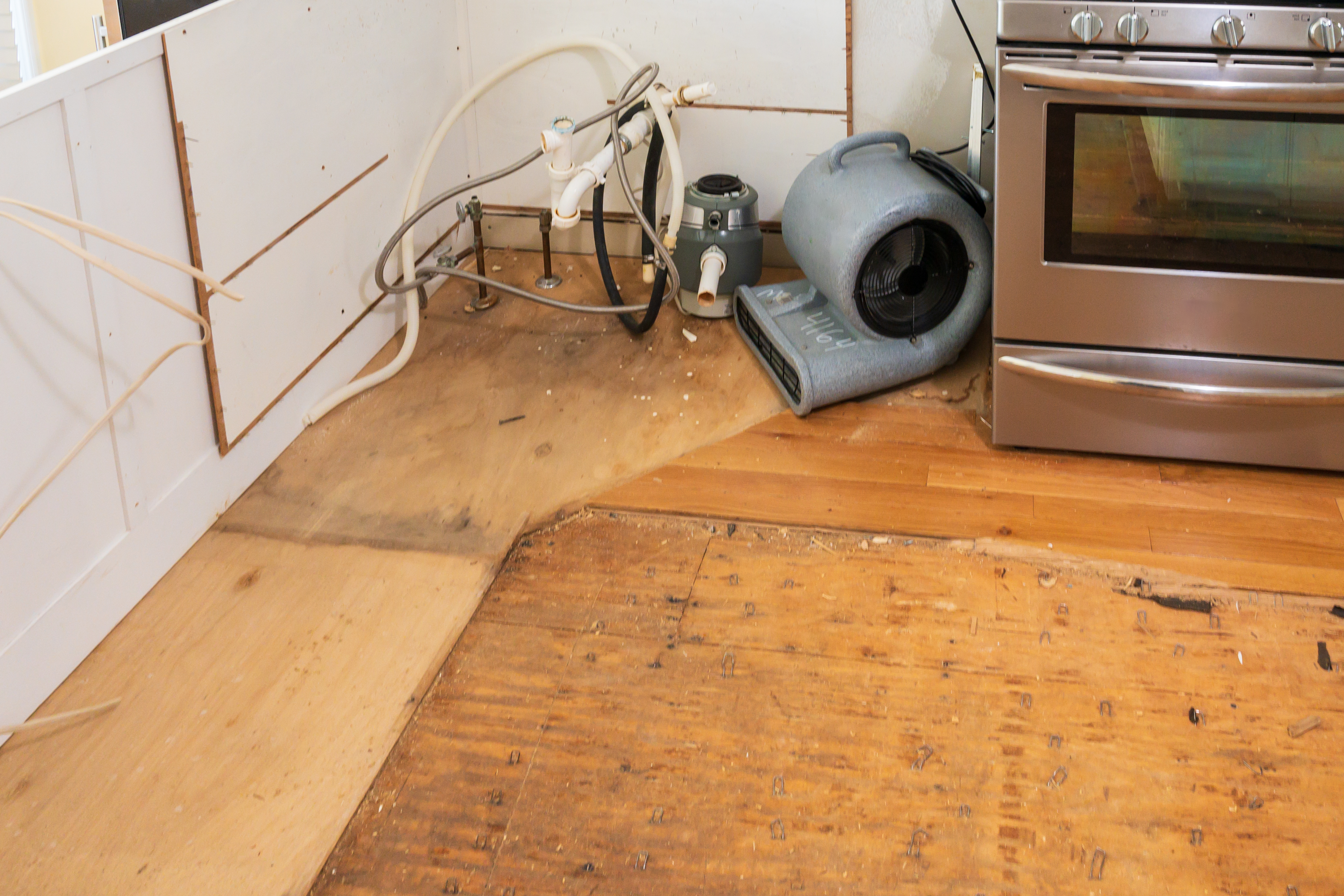 Hardwood floor pulled up after water damage 373d6c3364e36df3ff71