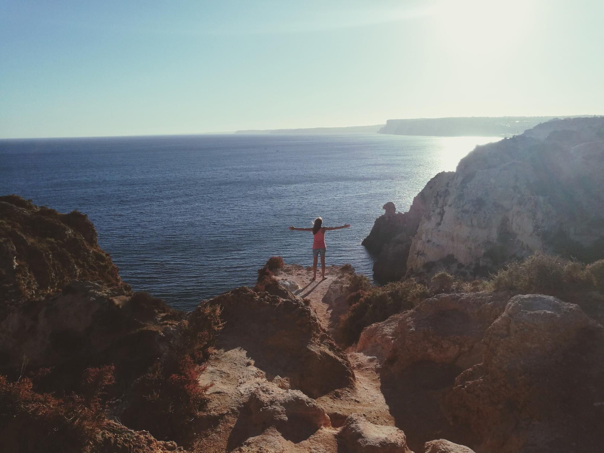 high angle view of woman with arms outstretched st 111dc128a7789450aa5b BTOURS