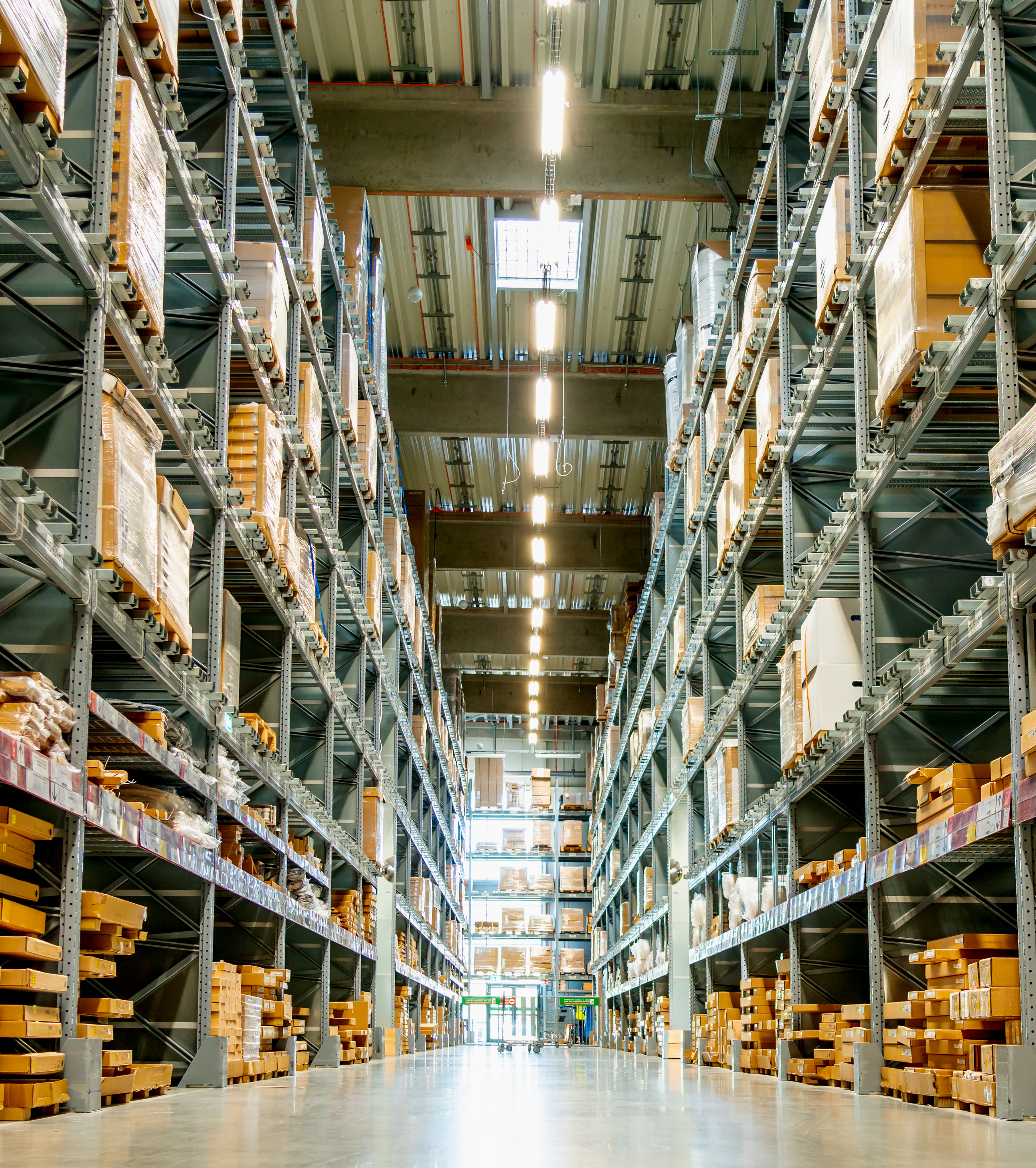 high racks in the aisle in a large warehouse verti 90c2cd95b3f75d813f9e