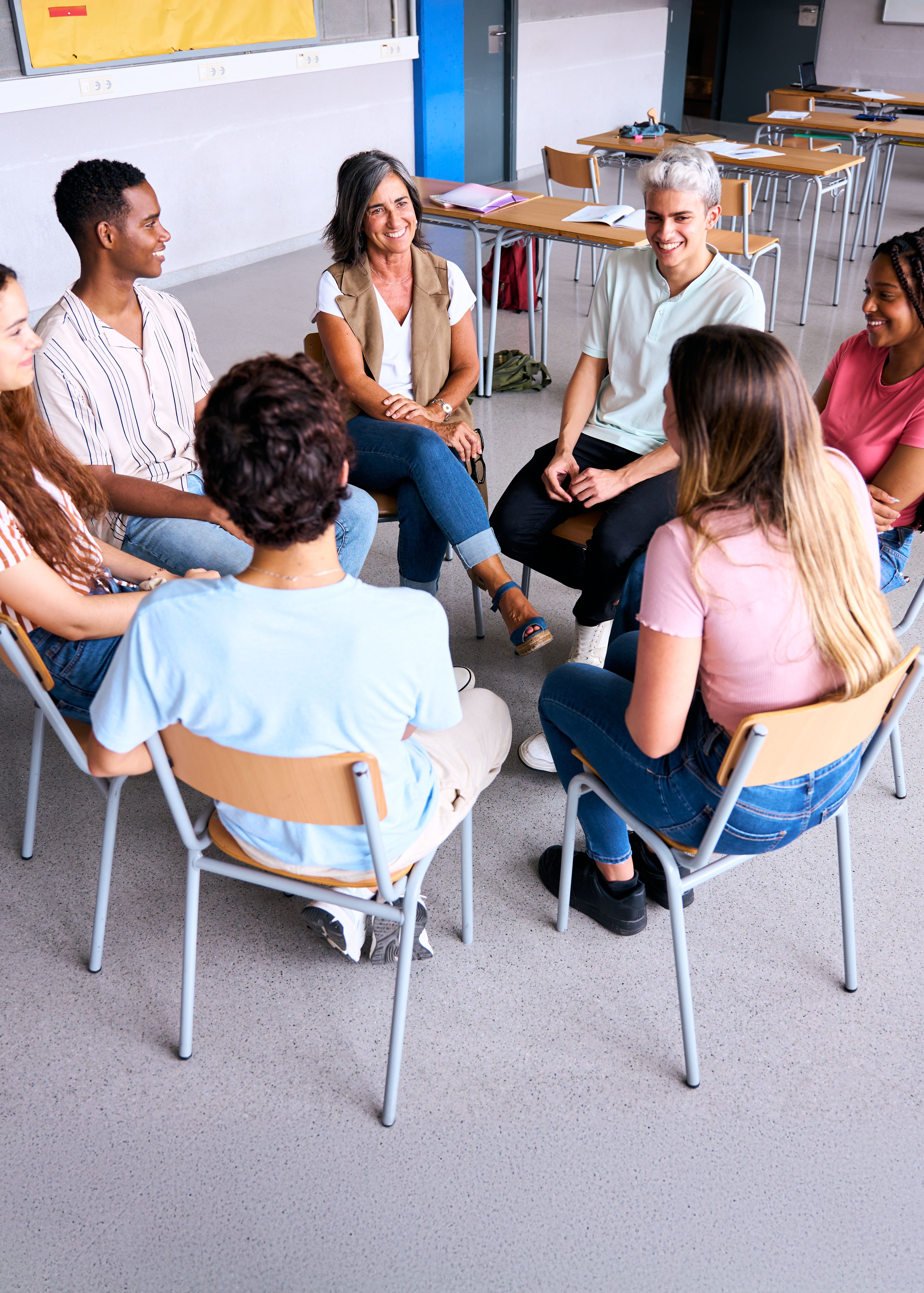 high school students and teacher talking in a circ 33f62739ad6d4ef711dd