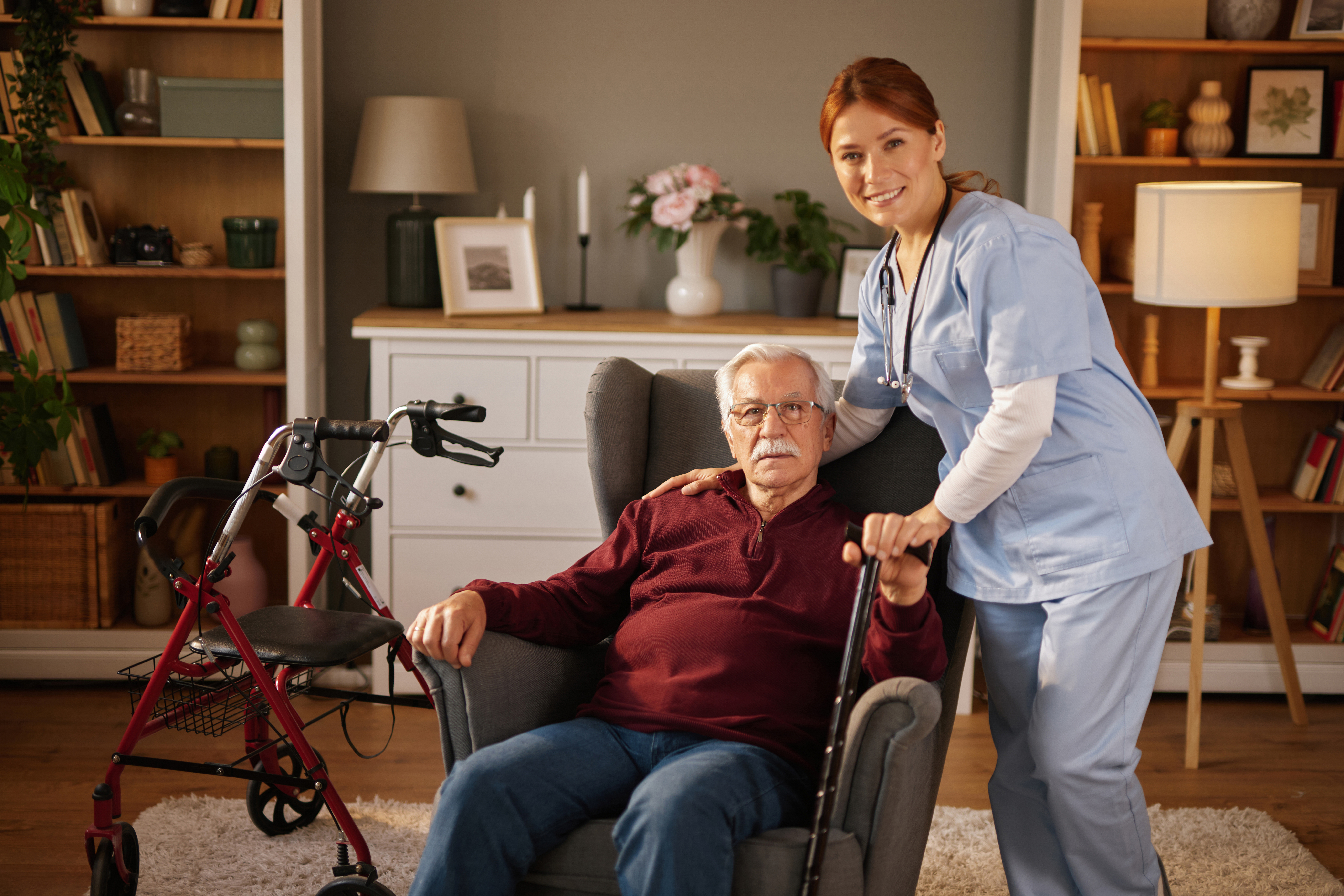 home healthcare nurse smiling and assisting elderl 66c5ad2c4e92435bcb70