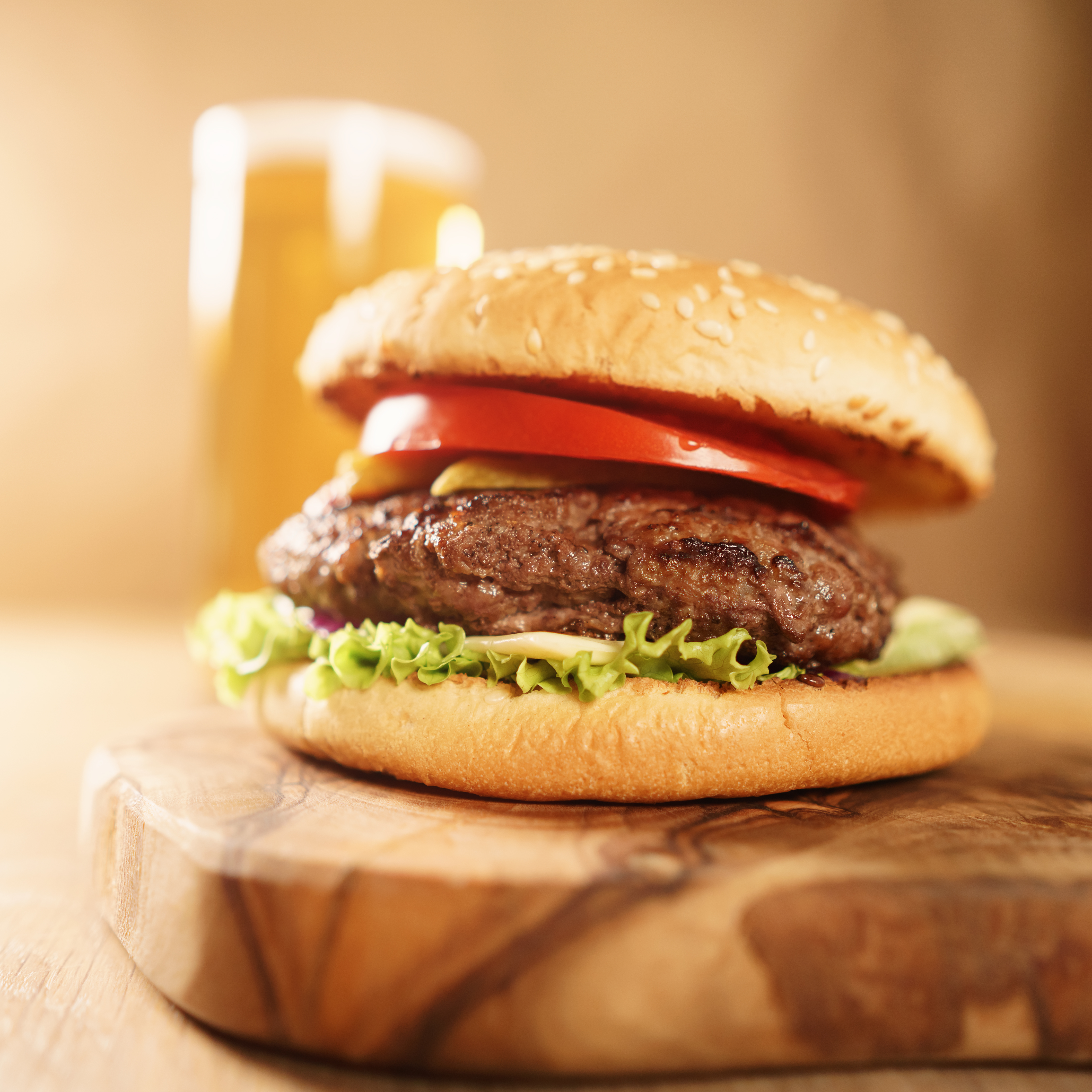 homemade hamburger with beer on background b965db1ca1877bbf7e48