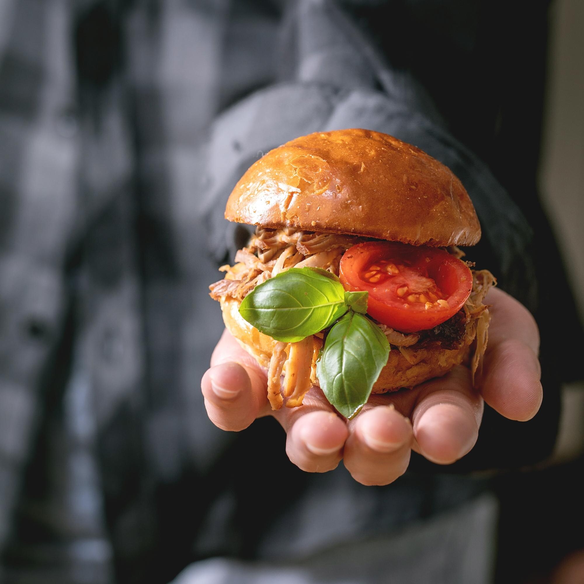 homemade mini burgers with stew beef in hands 4ba665f1b848f1296f9b