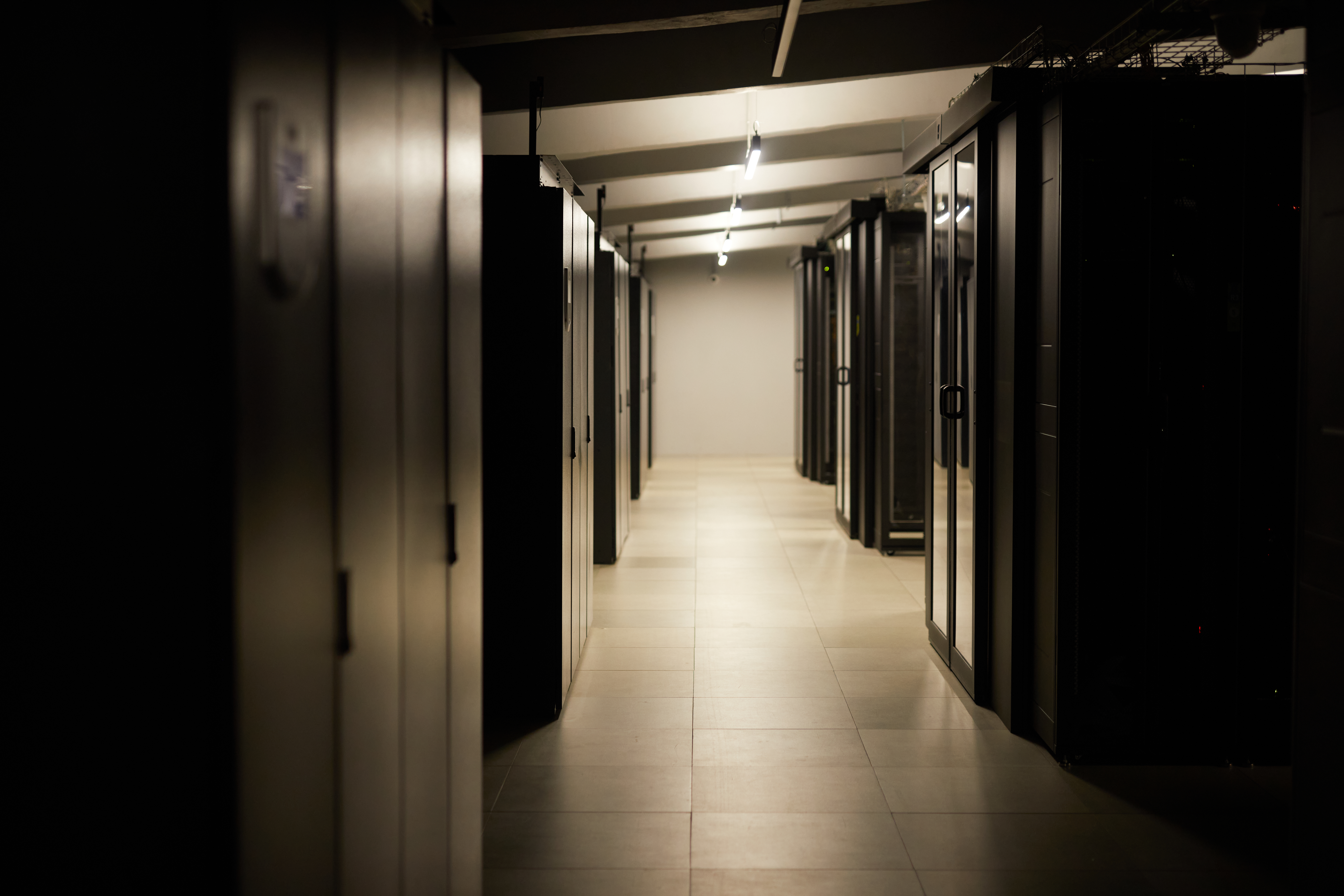 illuminated hallway in data center with server rac 074c54fea11d1ff6e8d9