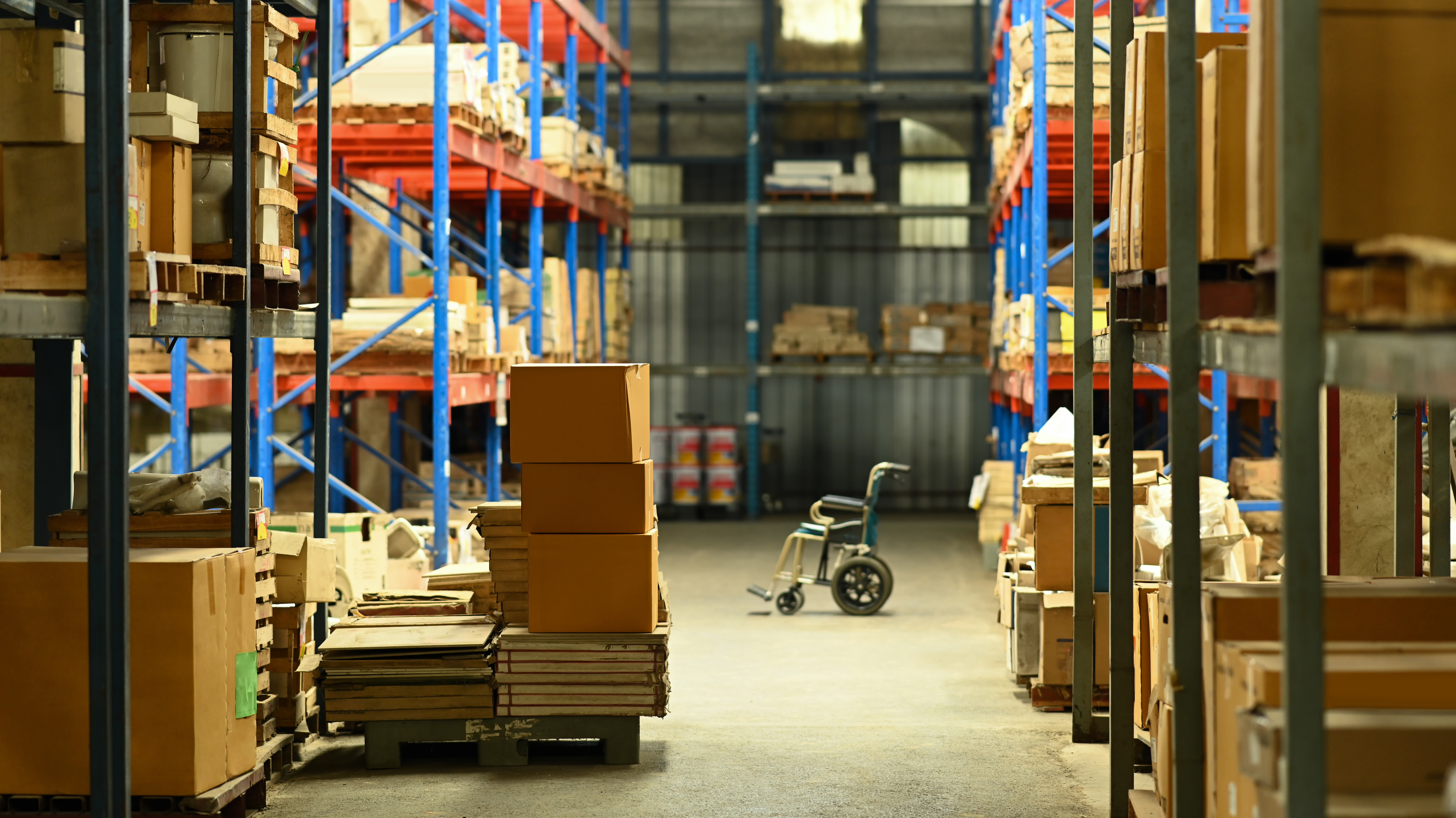 image of a wheelchair in large logistic distributi bbeff29d29fc11192e03