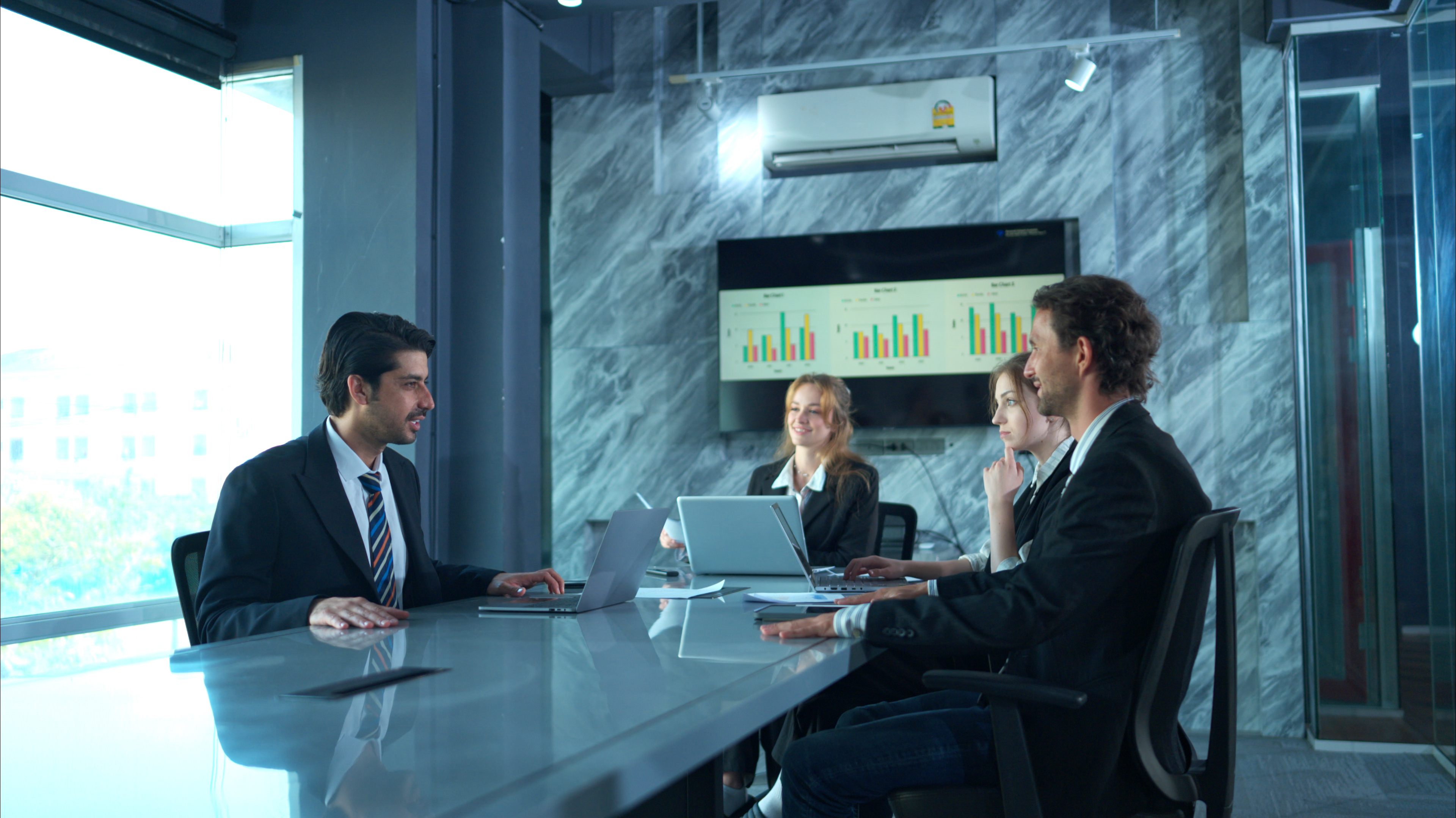 in the conference room a group of businesspeople aeeec229e6ac19e6a6d0
