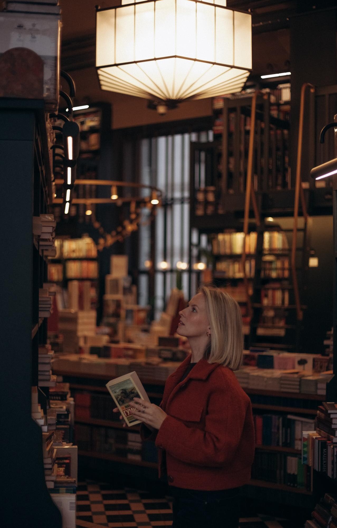 in the warm ambiance of a cozy library a woman lei 97a763f4a308744efc05