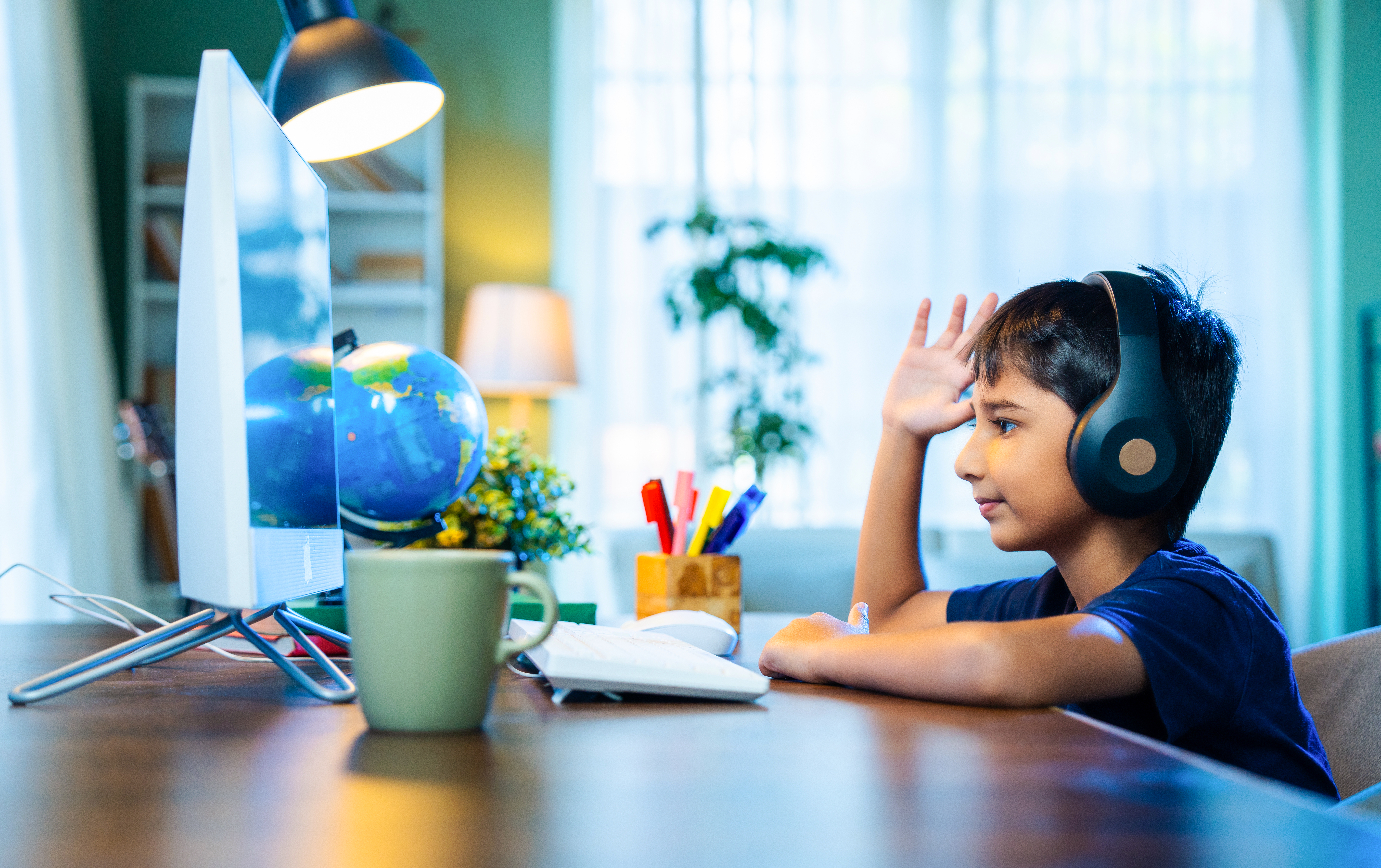 Indian Boy Attending Online Class At Home Using La 048f2196554993f9c612