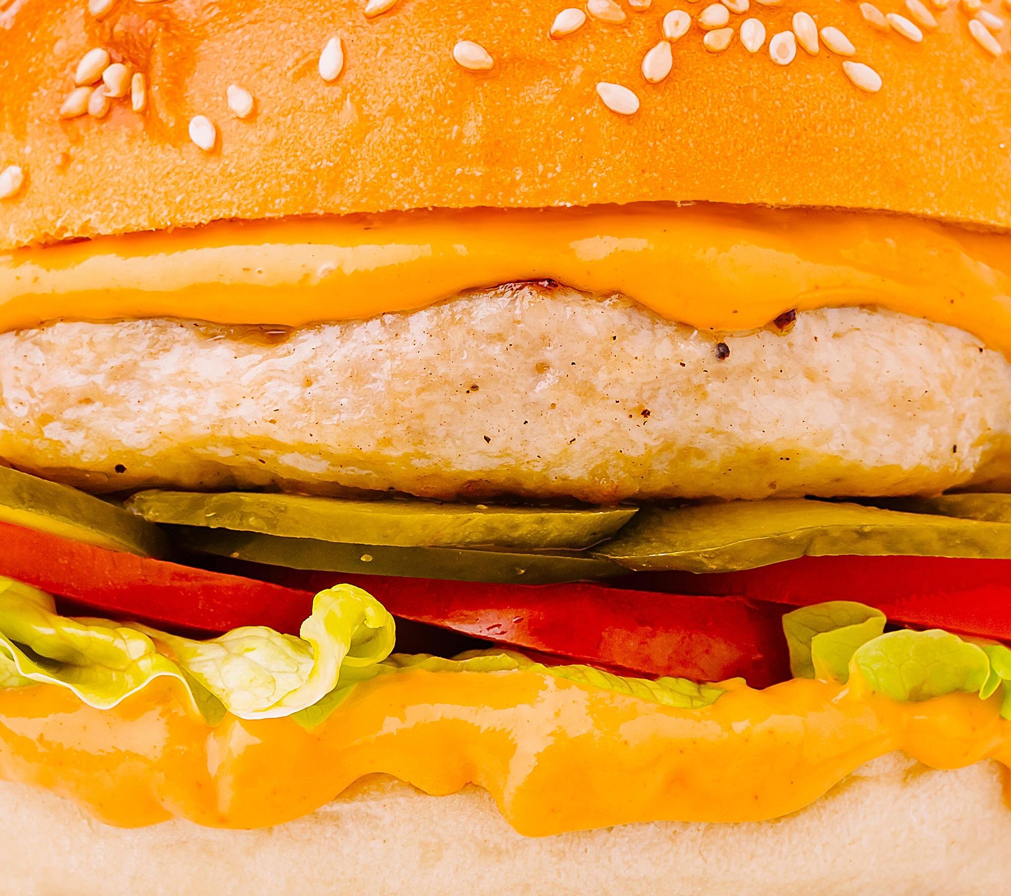 juicy burger loaded with fresh vegetables and crea 0dbea5ec01d05d3dd380