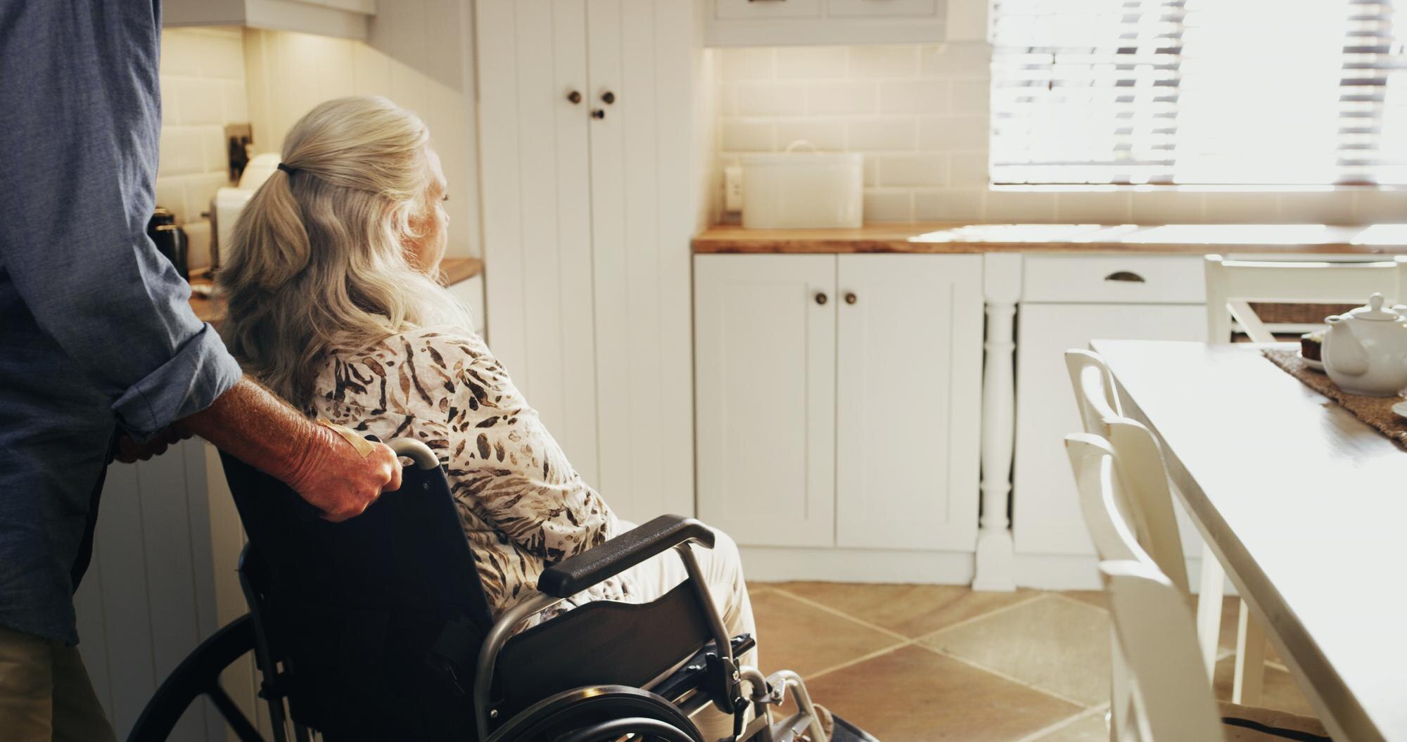 kitchen tea and wheelchair with senior couple in h 61a27e479c81848633ba