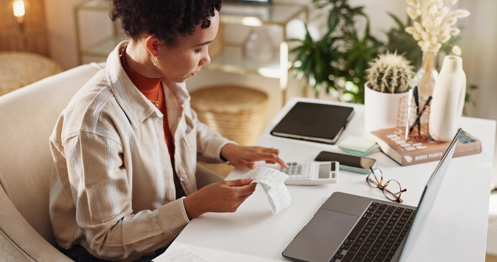 laptop bills and woman in home office with calcula 06b8b9d736f14132a5eb