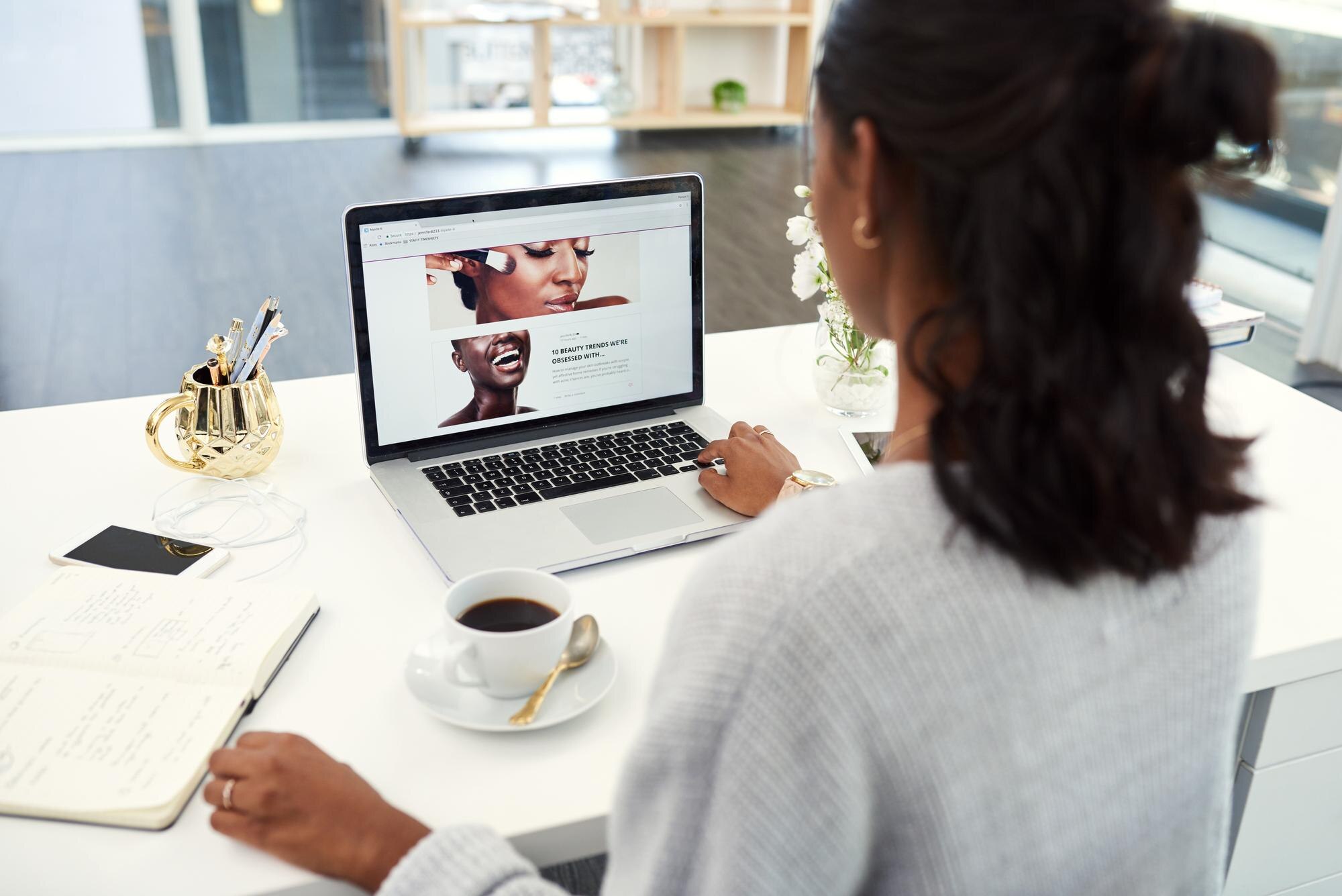 laptop coffee and woman with notebook in office re f0c4cd6abc3a3af29032