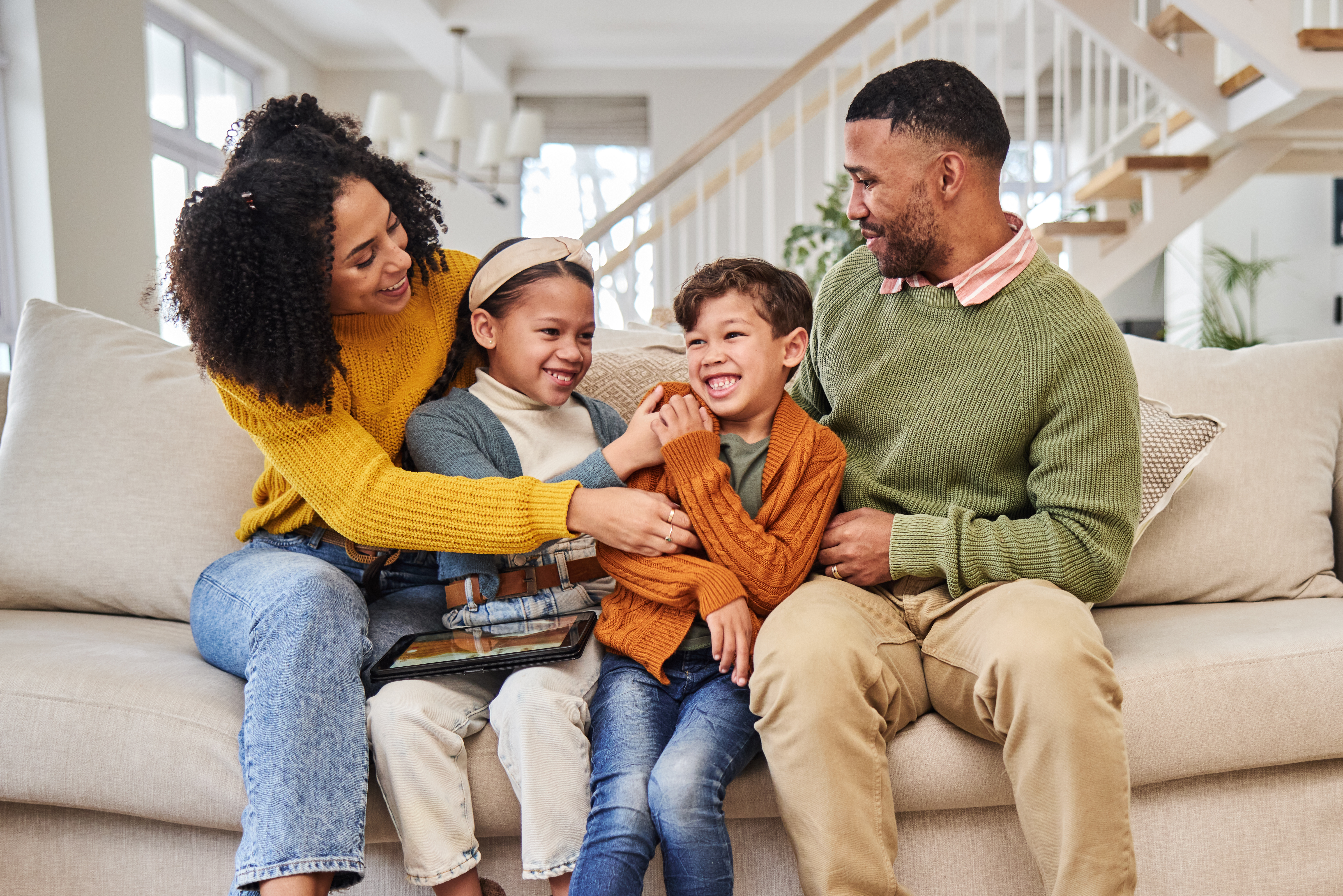 laughing family and children in home with winter e3271302b71f11aa95ff