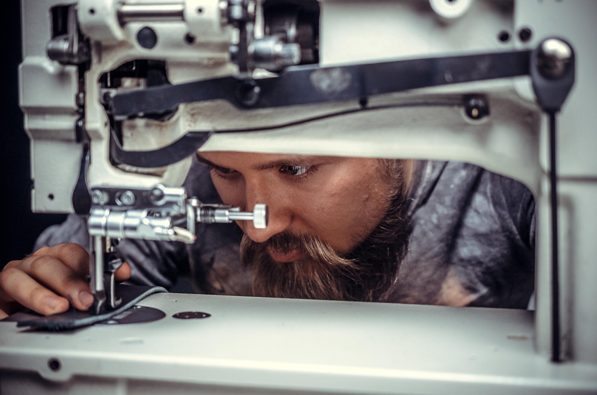 From CAD to Reality: How Expert Plastic Fabrication Powers Complex Project Designs 1 leather tanner demonstrates leather cutting proces 015a36a54540e198e422