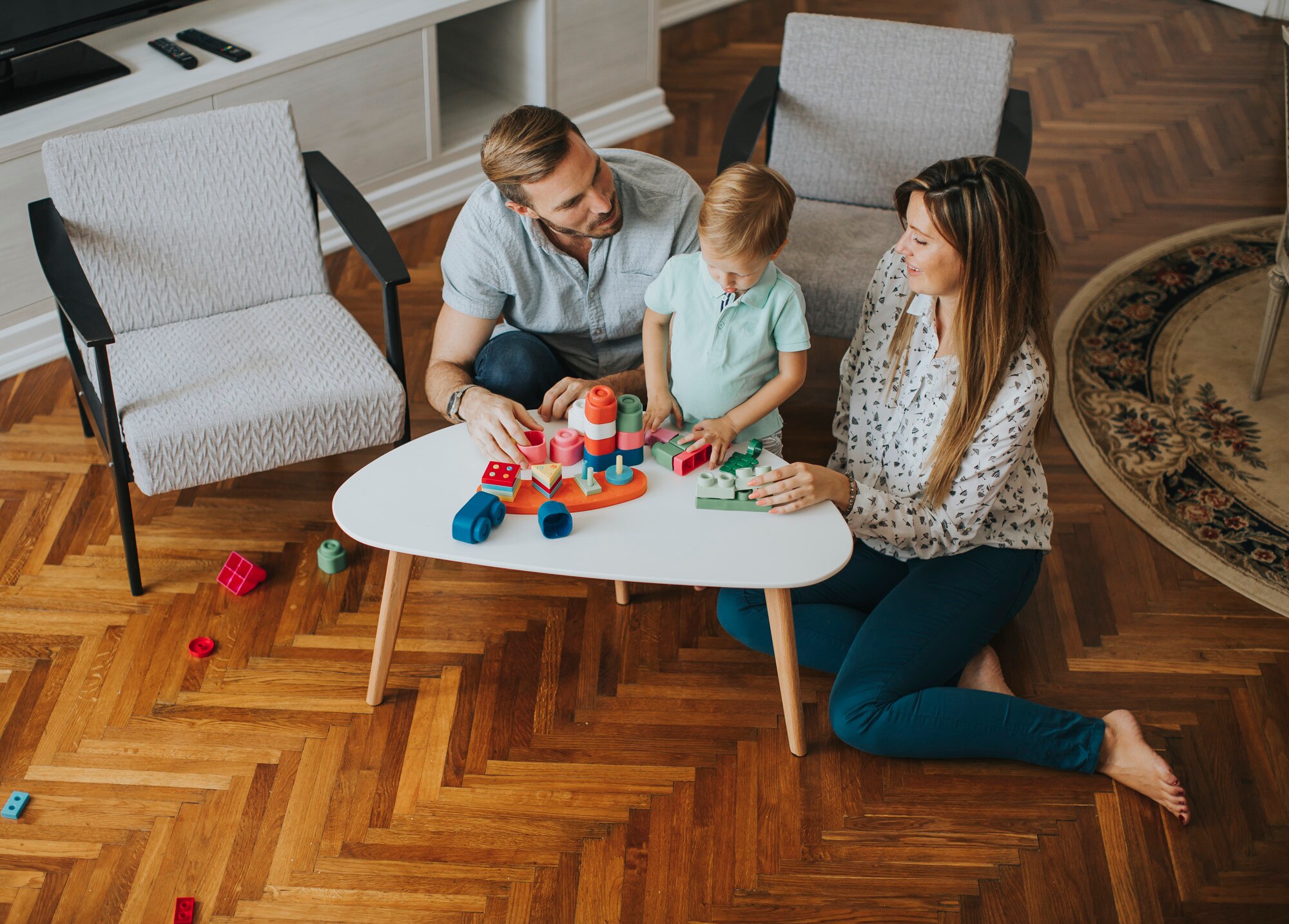 little boy playing with toys in the living room wi 078586f47ce6afe5ad82