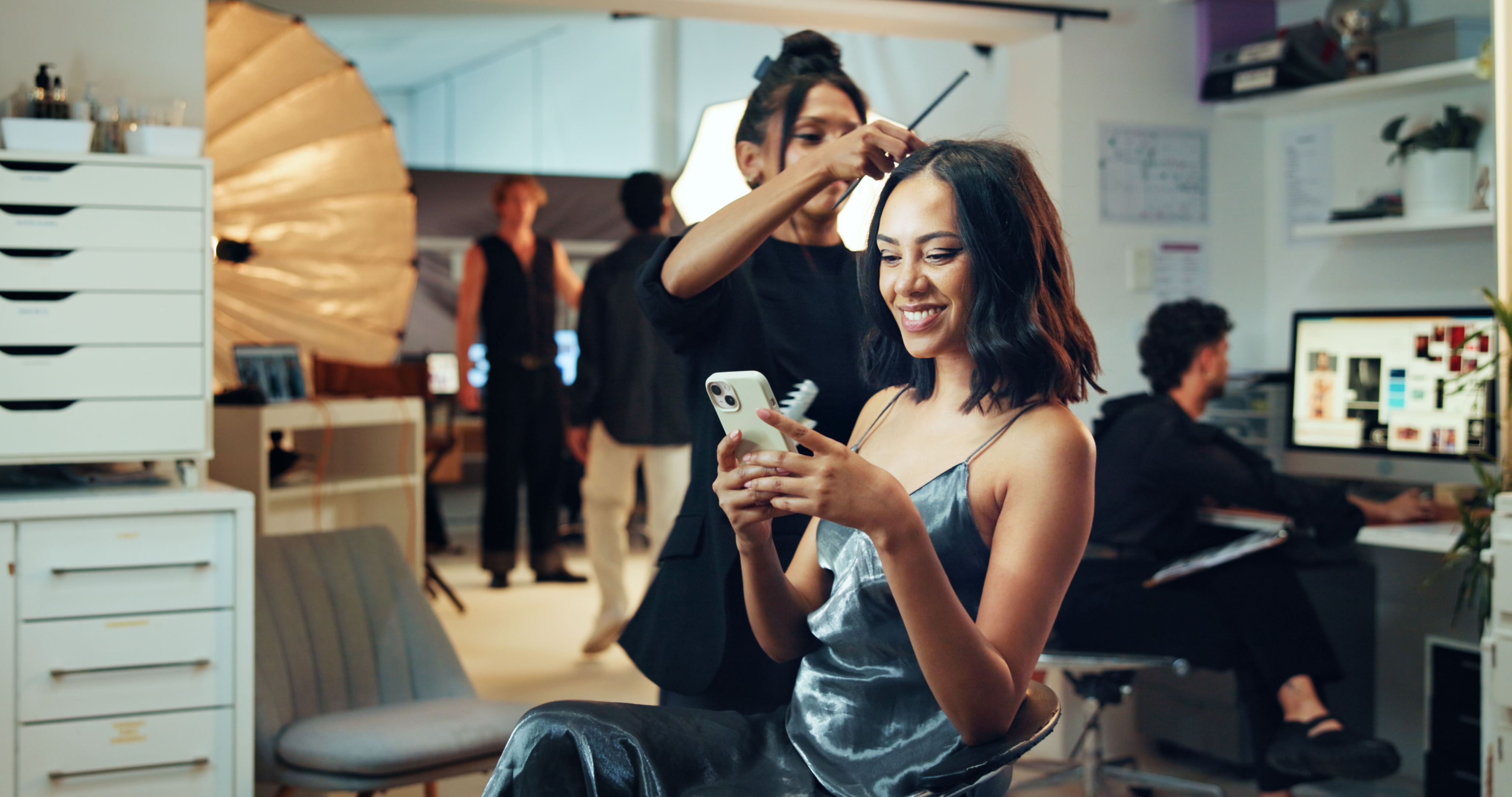 makeup phone or photography with hair stylist and 2373ab099f08c10f07d1 Liberating Beauty Professionals: The Impact of Contract-Free Booking Models