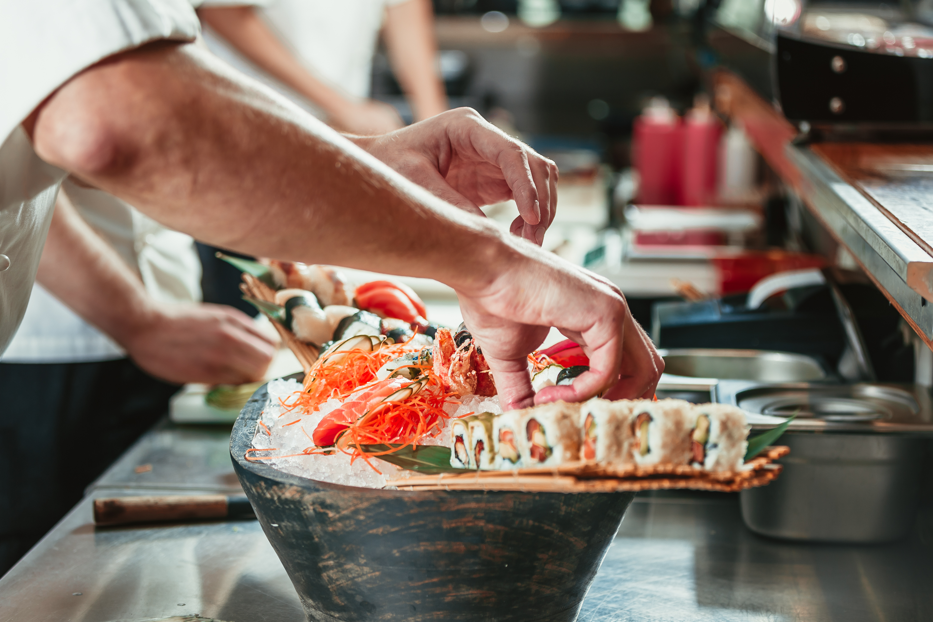 male cooks preparing sushi d1423f1d1ea45e08abb5